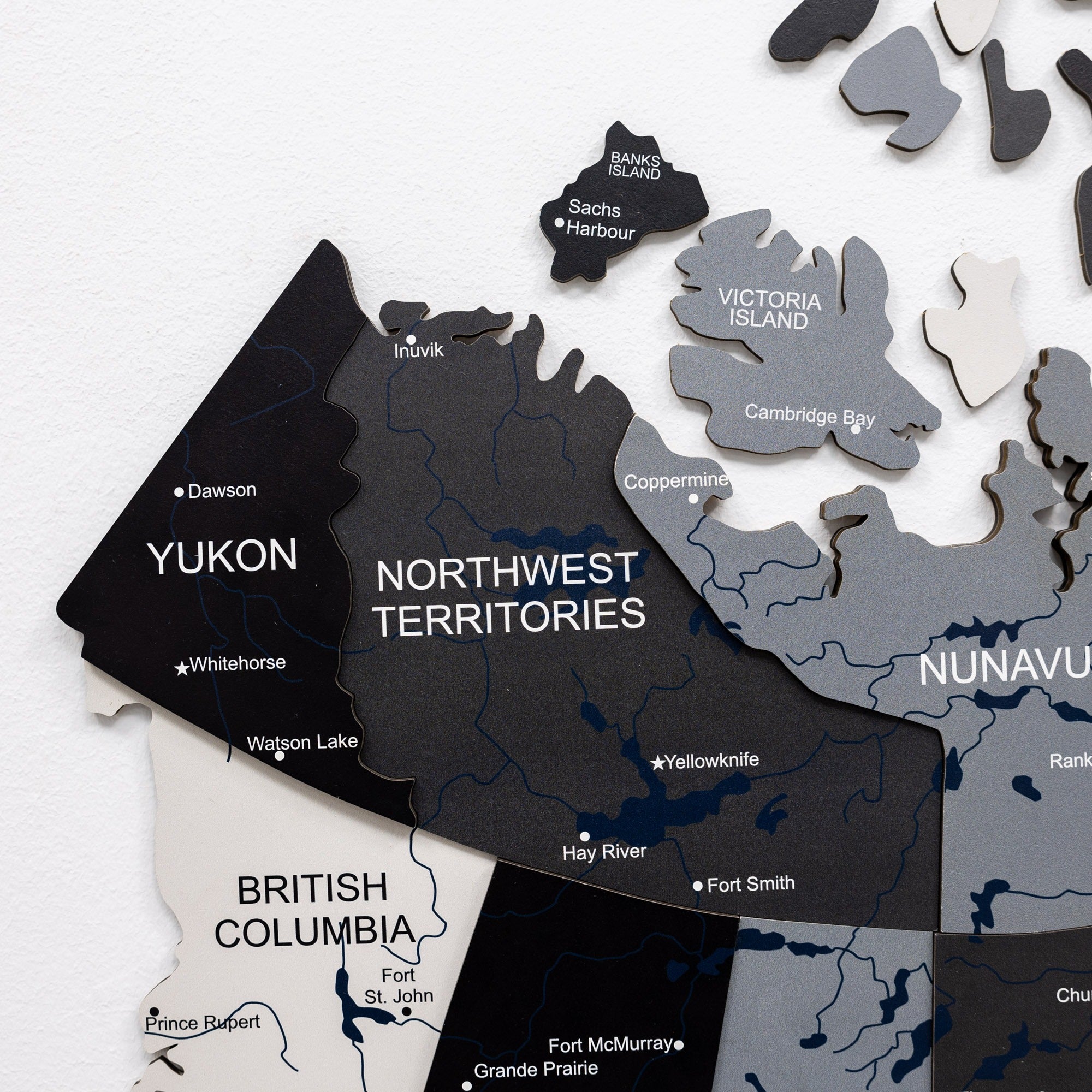 Map puzzle pieces of Canada on a white background