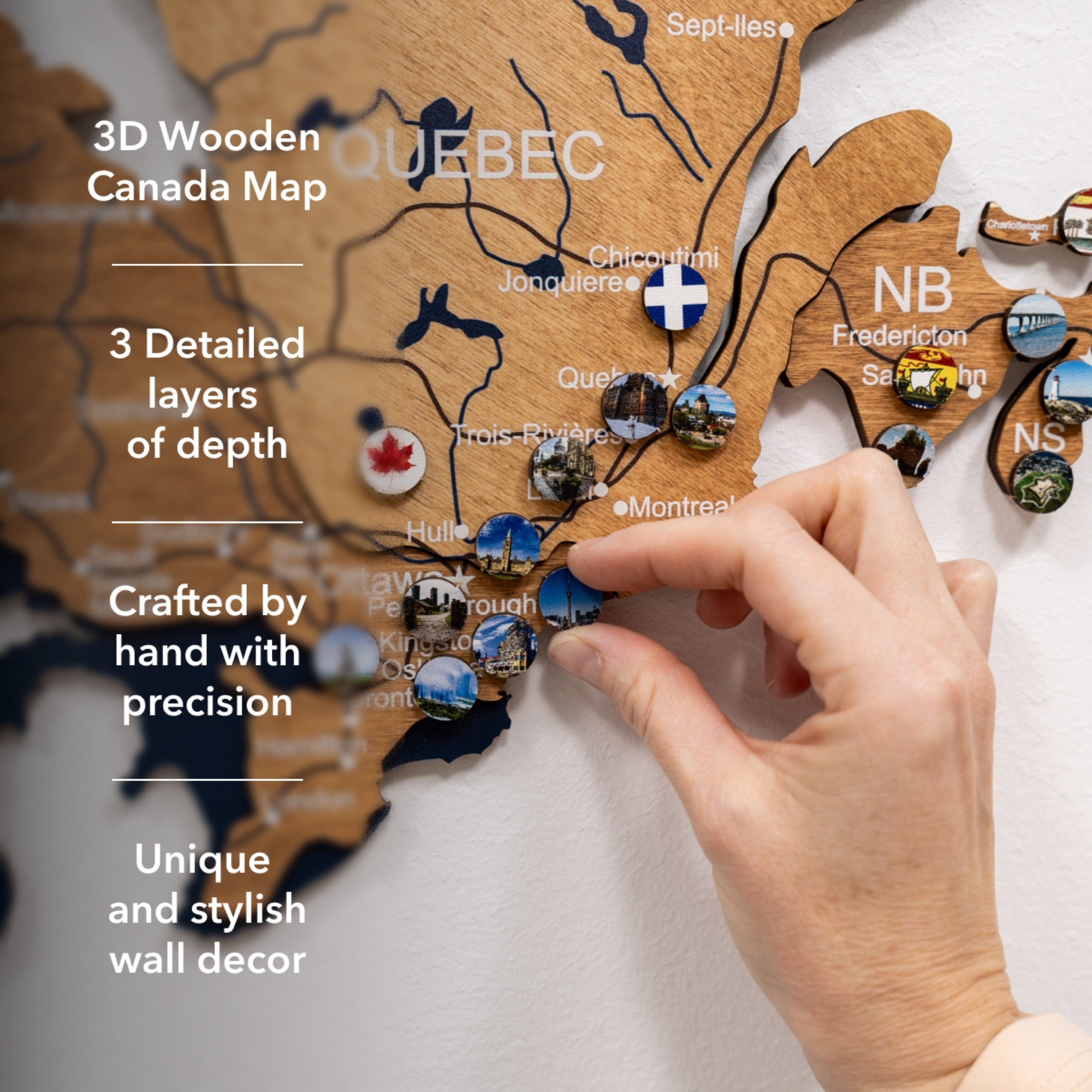 3D wooden map of Quebec with a hand interacting with it, on a light background.