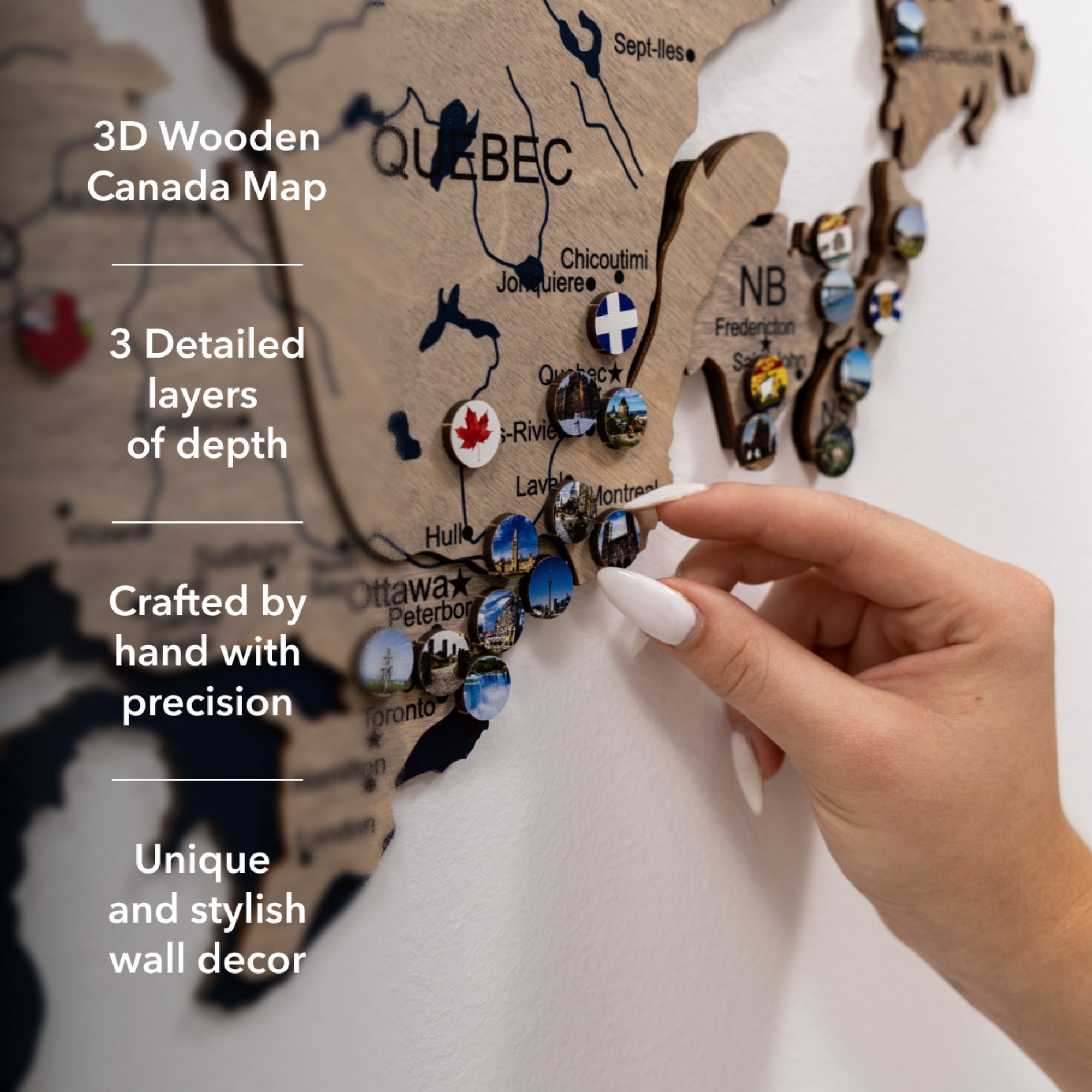 3D wooden Canada map with detailed layers, hand holding a small flag, on a white background.