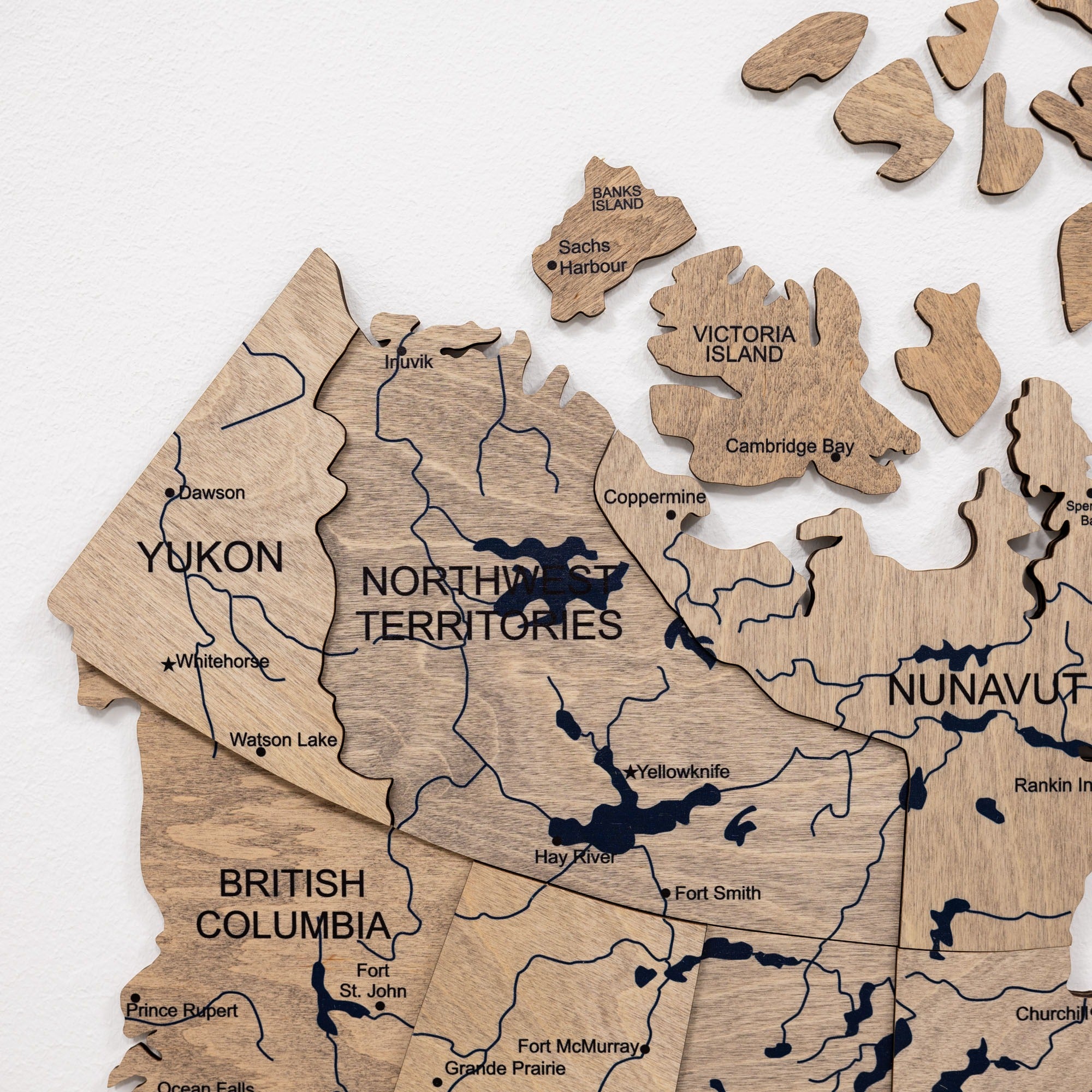 Wooden puzzle map of Canada with regions labeled