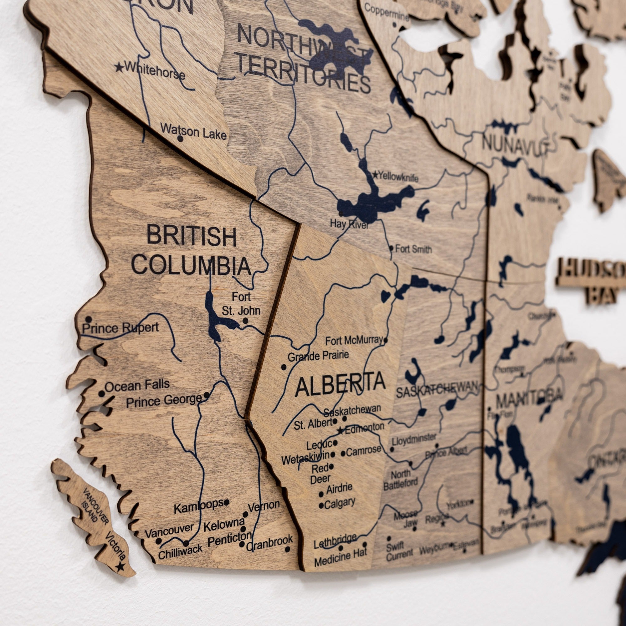 Wooden map of Canada with British Columbia and Alberta highlighted