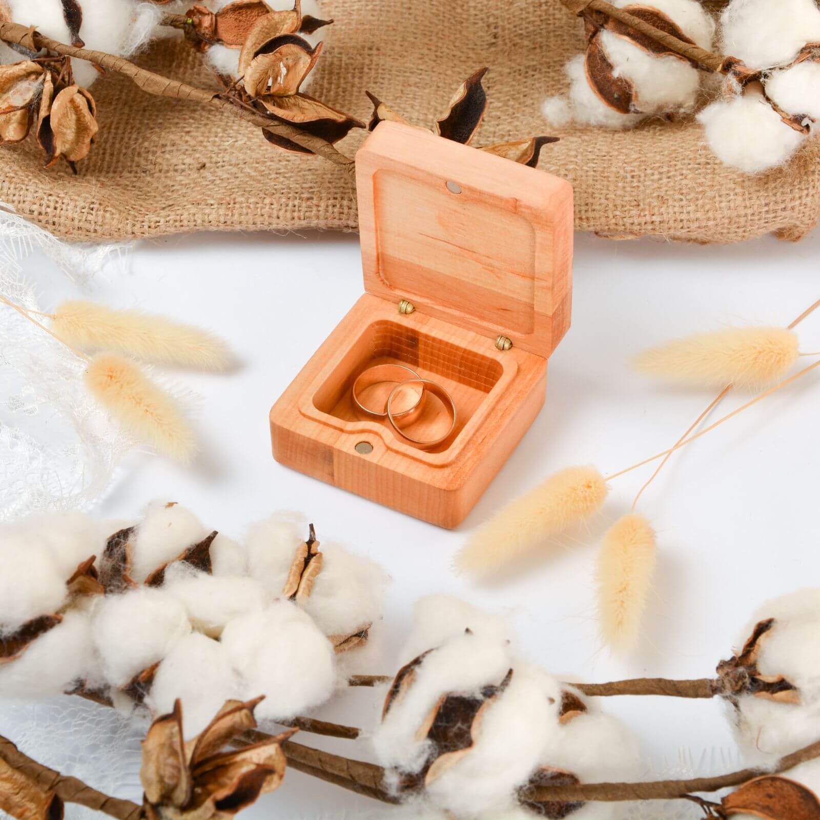 Wooden wedding ring box with cotton flowers decoration.