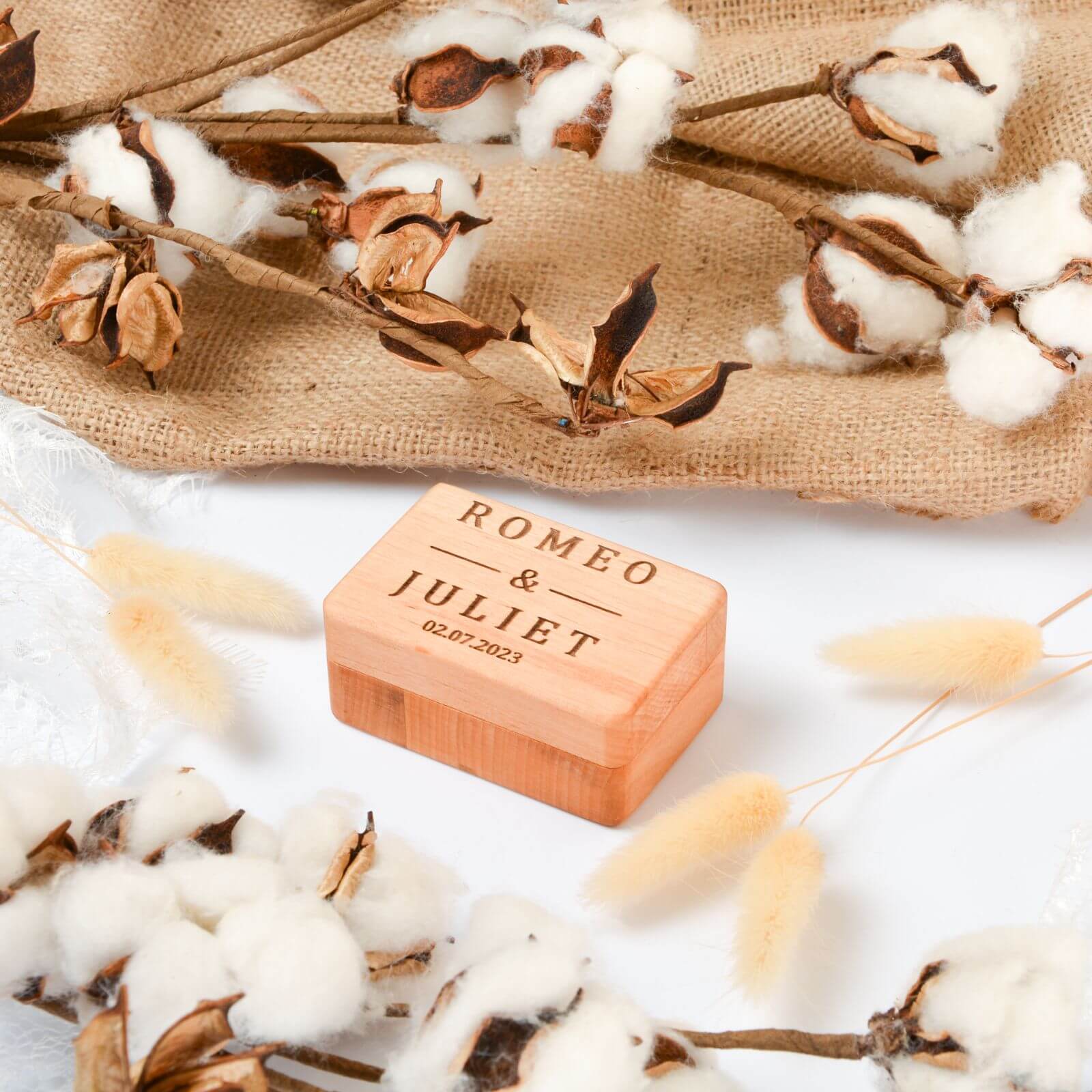 Personalized wooden ring box engraved with Romeo and Juliet.