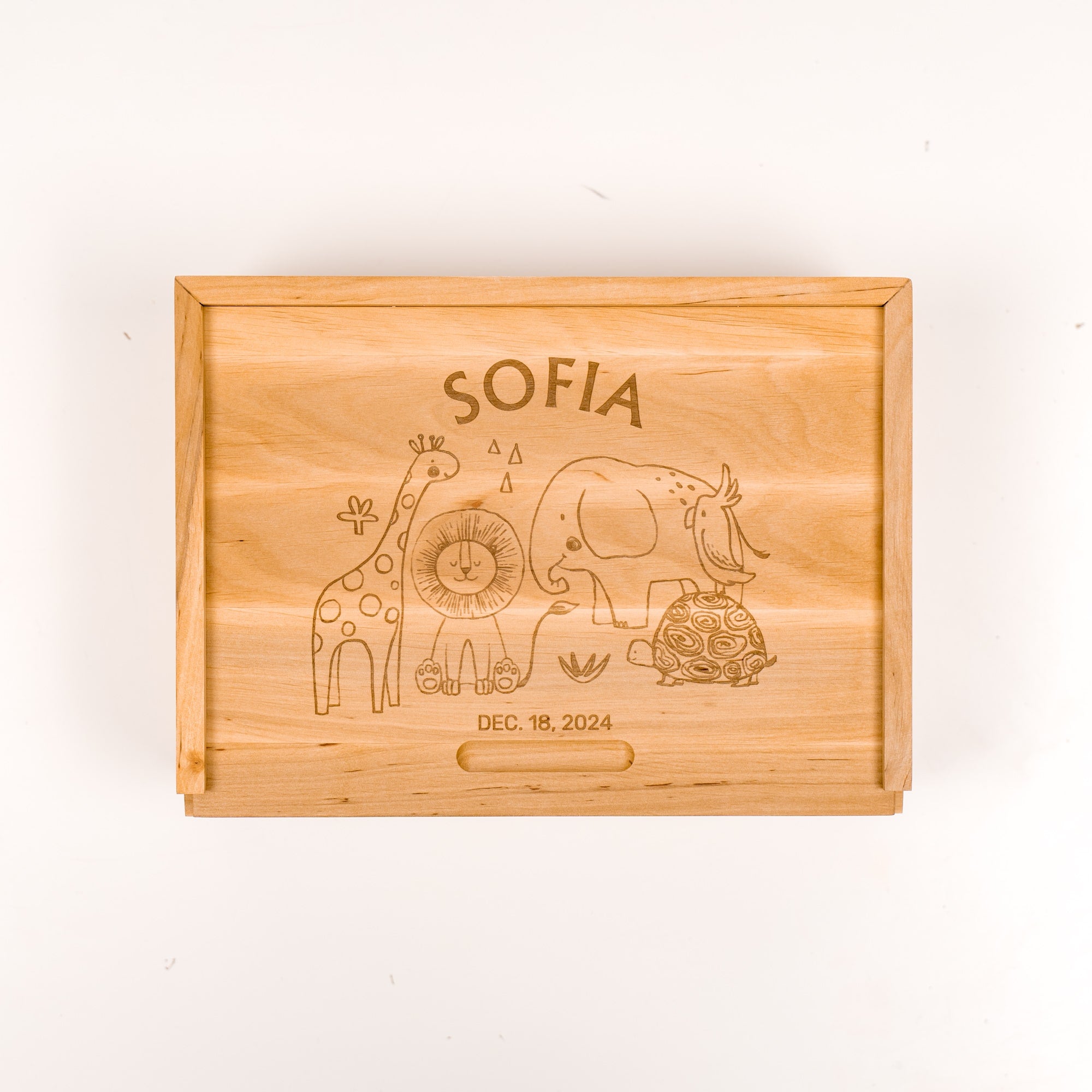 Wooden box with engraved animals and 'SOFIA' on a white background