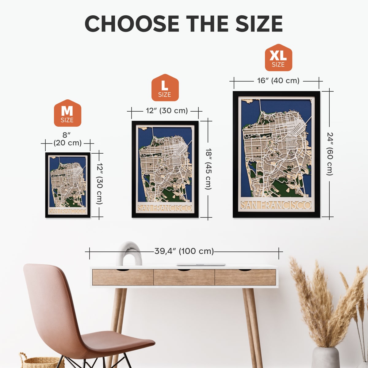 Size chart for framed maps with dimensions and a desk and chair in the background.