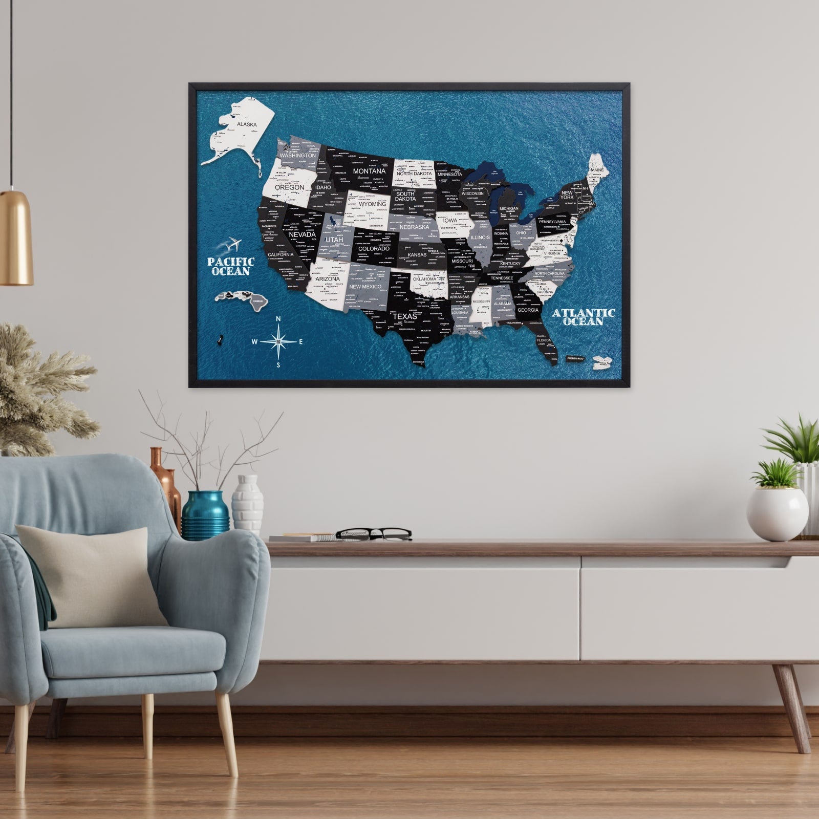Framed map of the United States on a wall in a living room setting.