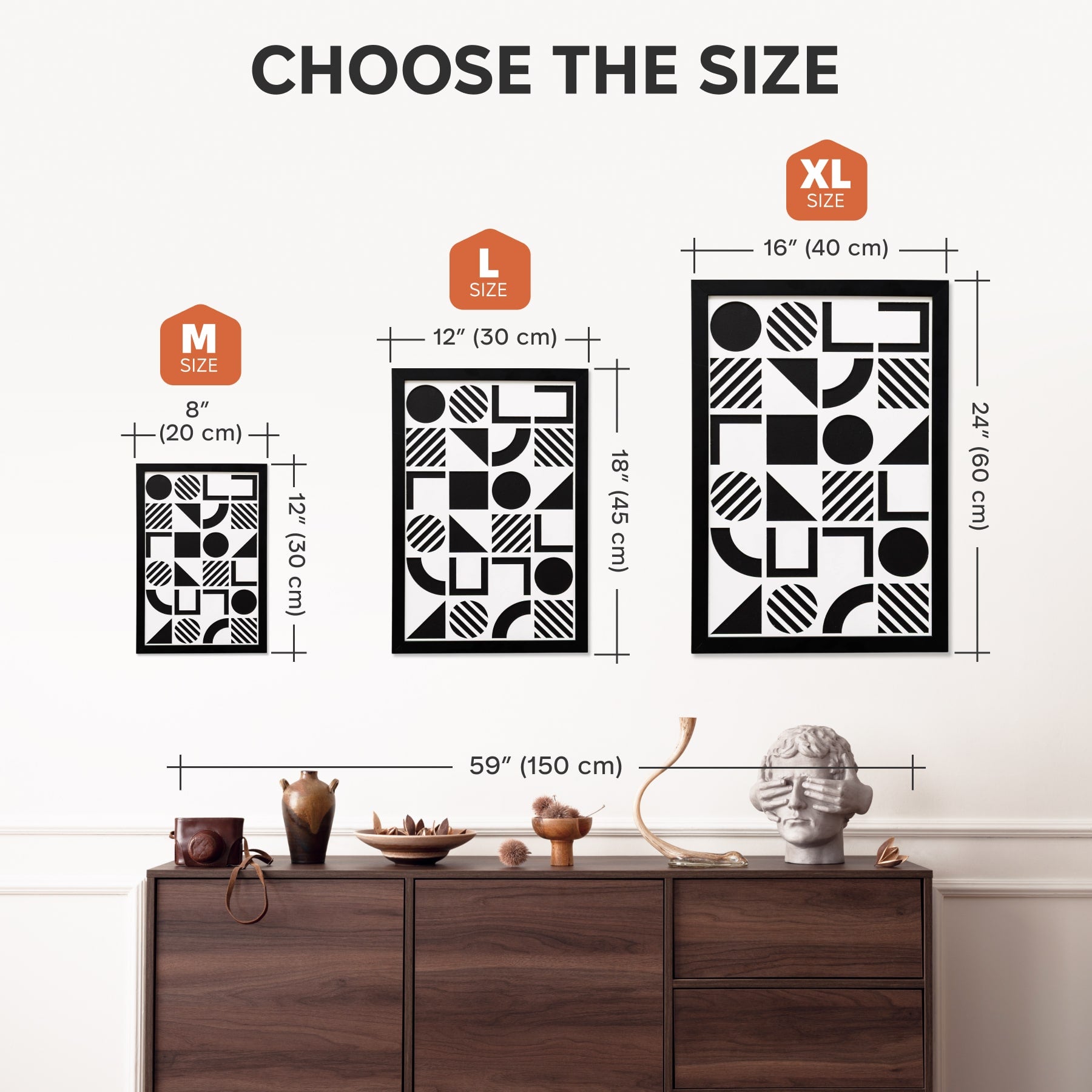 Size chart for wall art with geometric designs, displayed on a wall above a wooden cabinet.