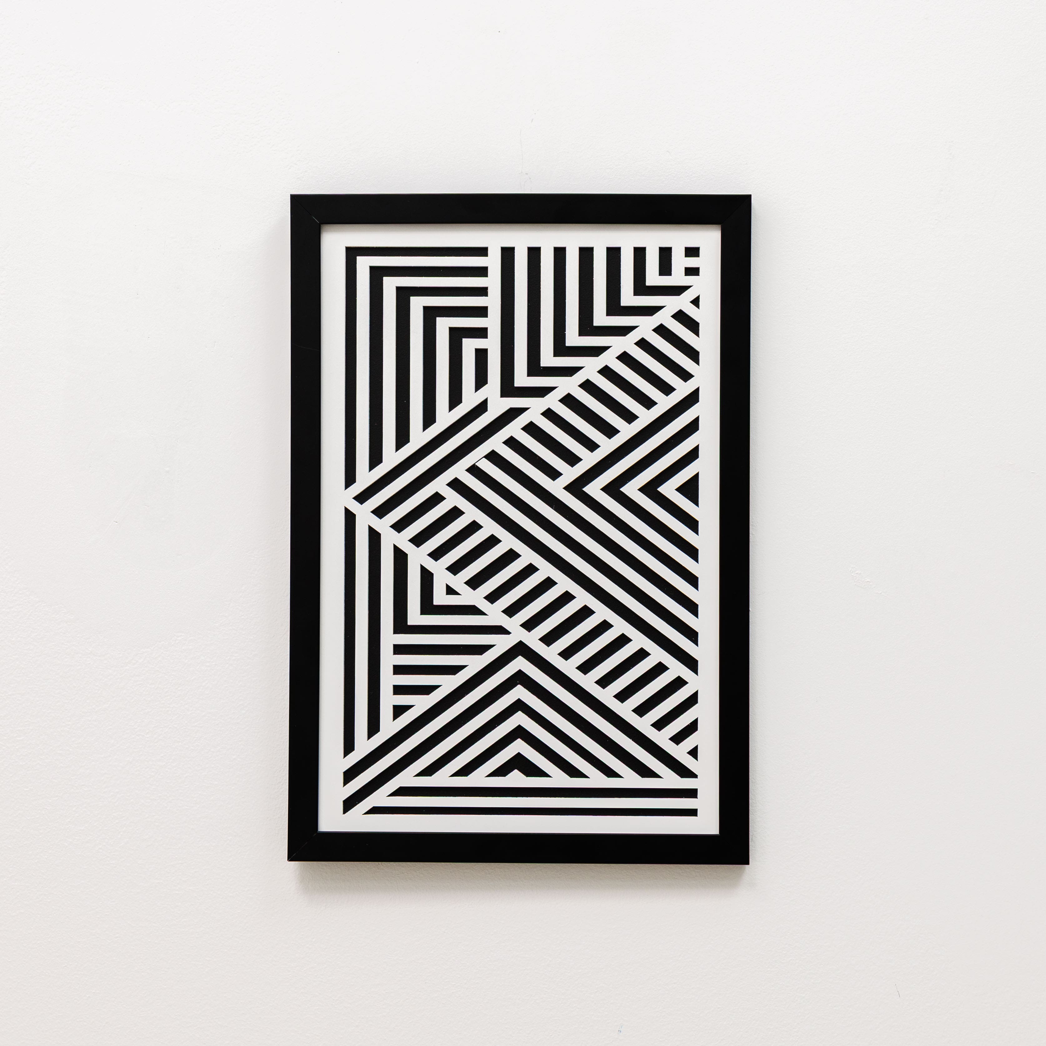 Framed black and white geometric art on a white background