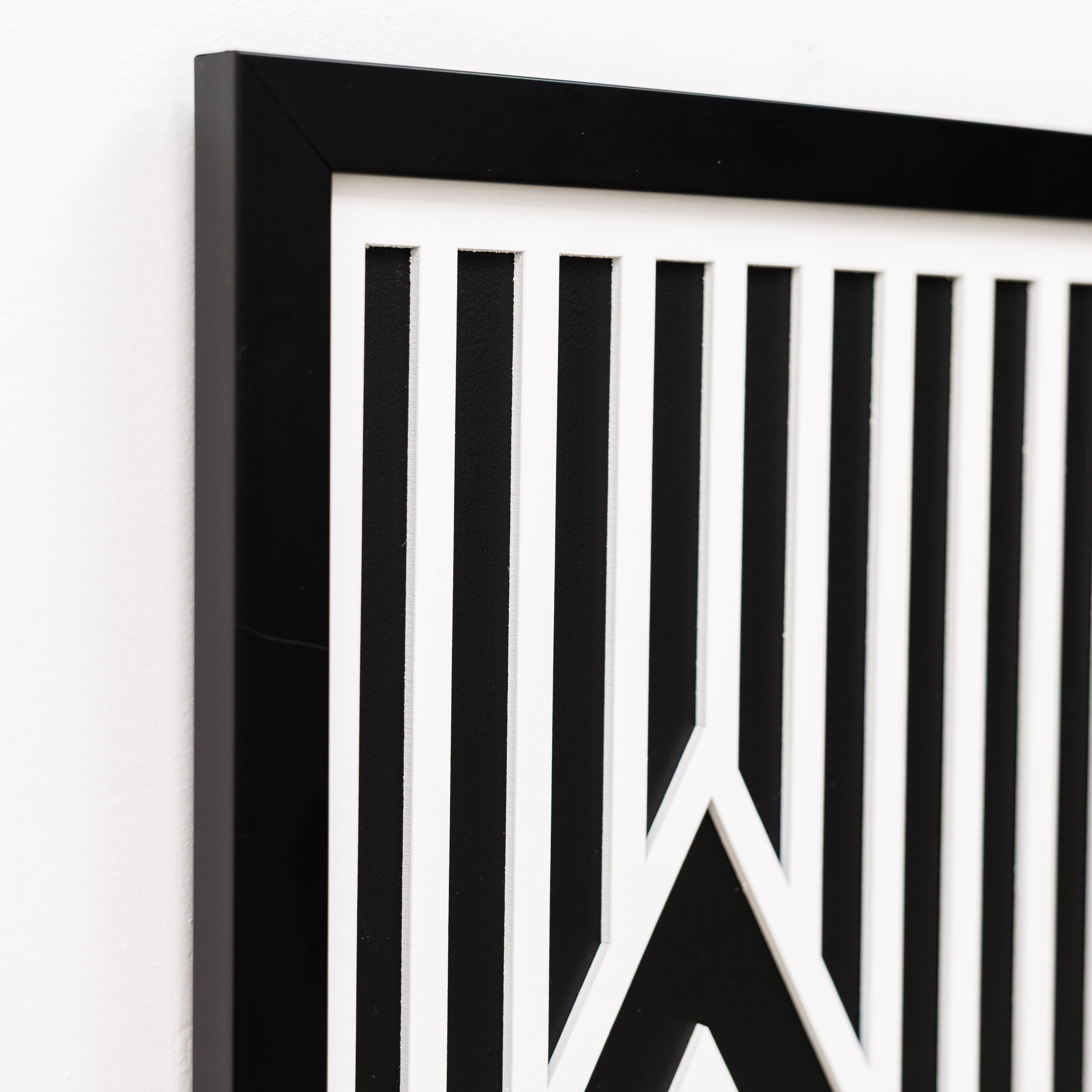 Black and white geometric design on a white background