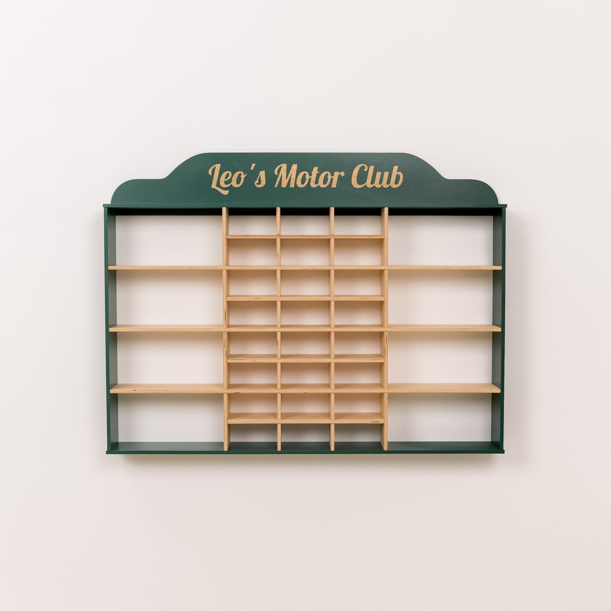 Wooden board with green frame and 'Leo's Motor Club' text on a white background