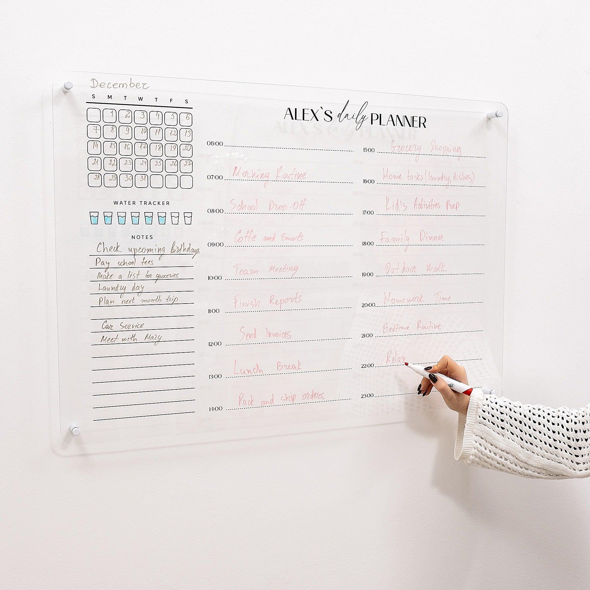 Baby planner with a hand writing on it against a white background