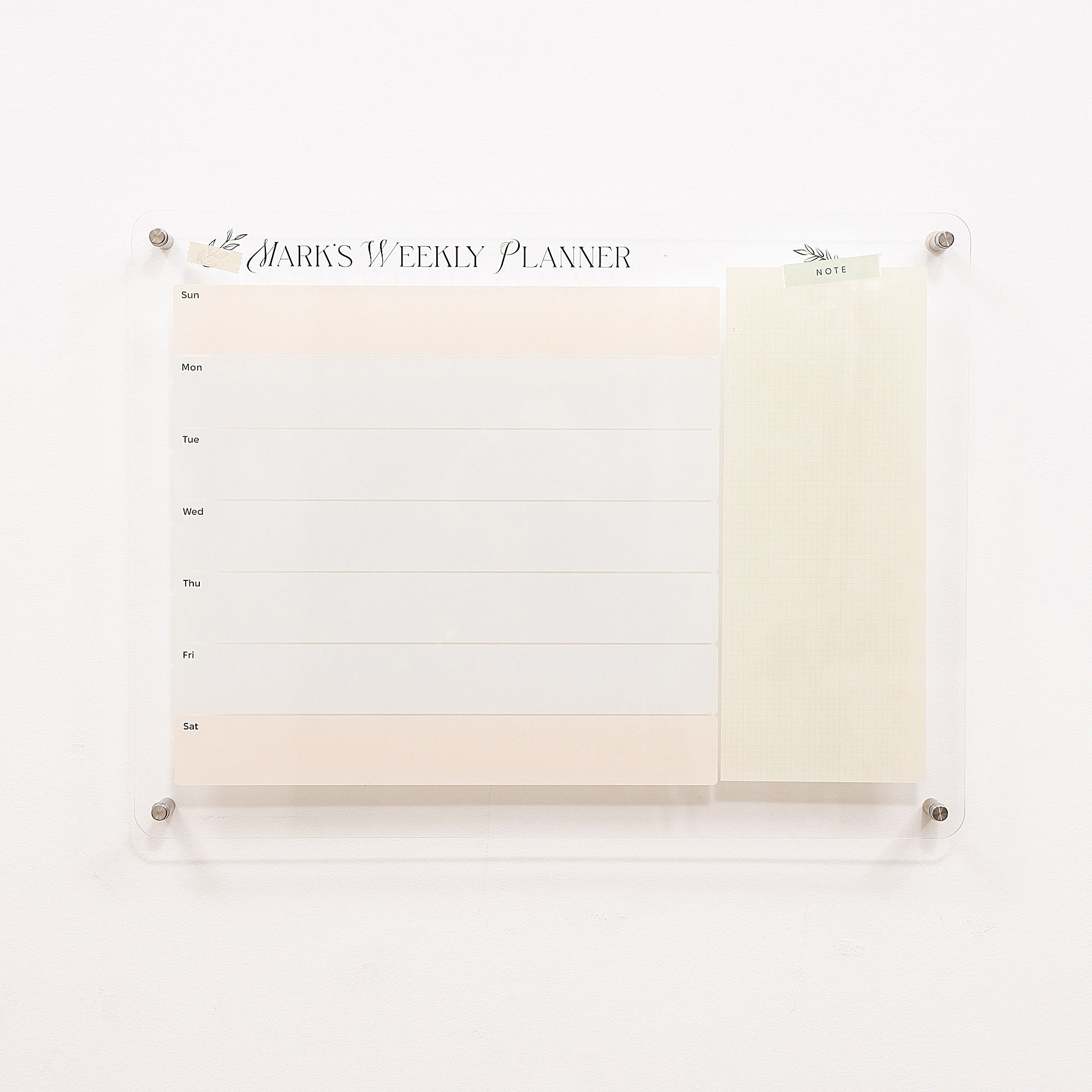 Weekly planner with a white cover on a white background