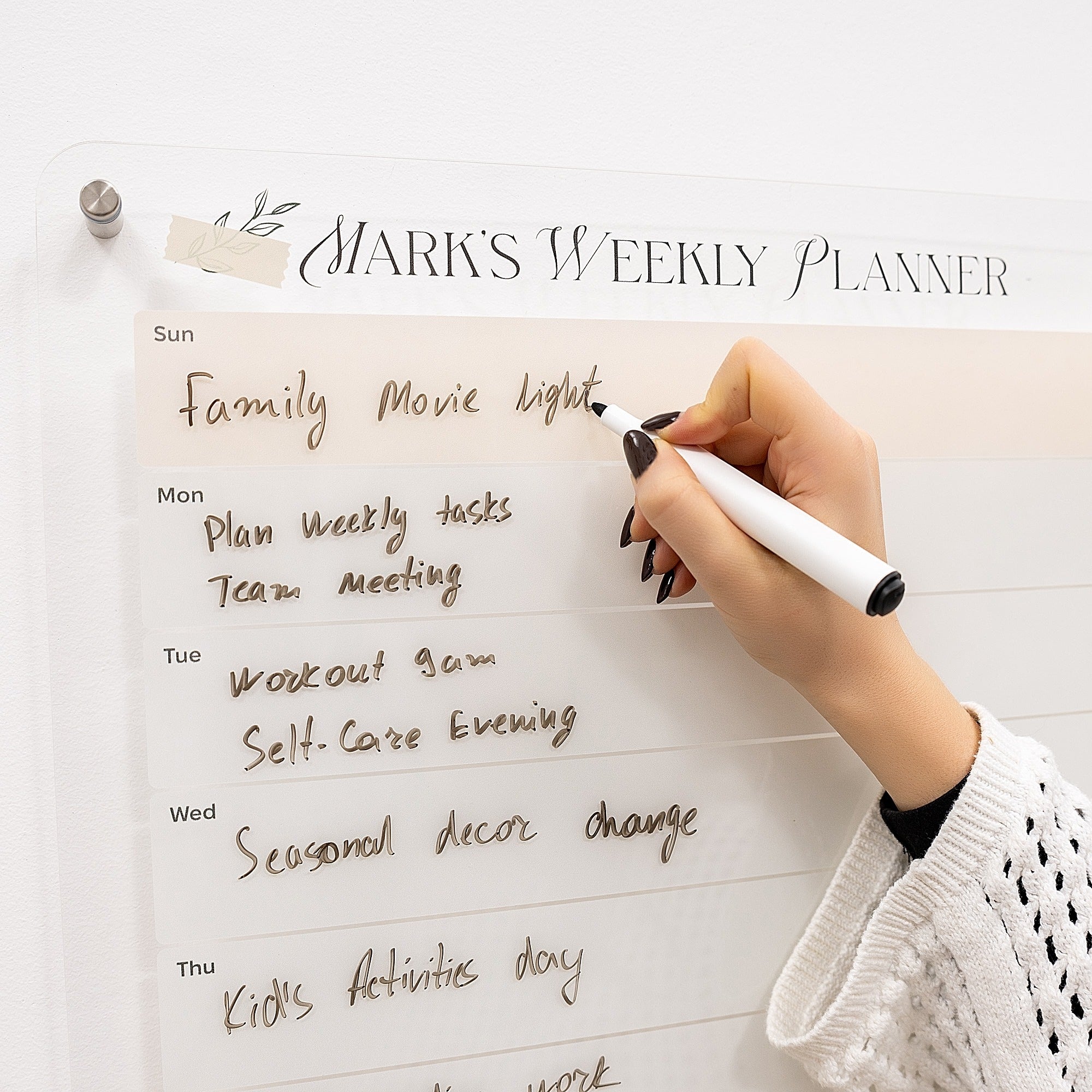Hand writing on a weekly planner with 'Mark's Weekly Planner' at the top.