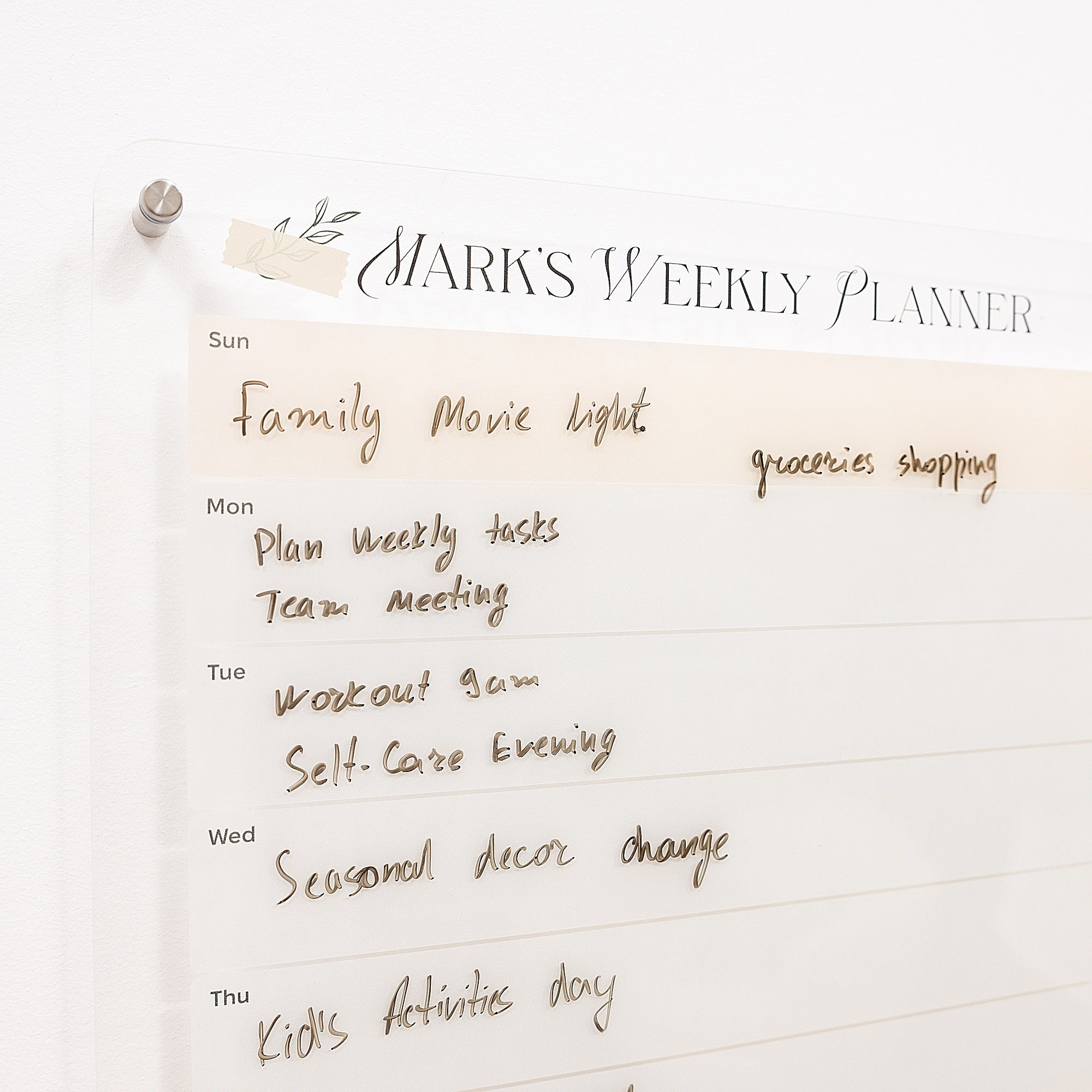 Weekly planner with handwritten tasks on a white background