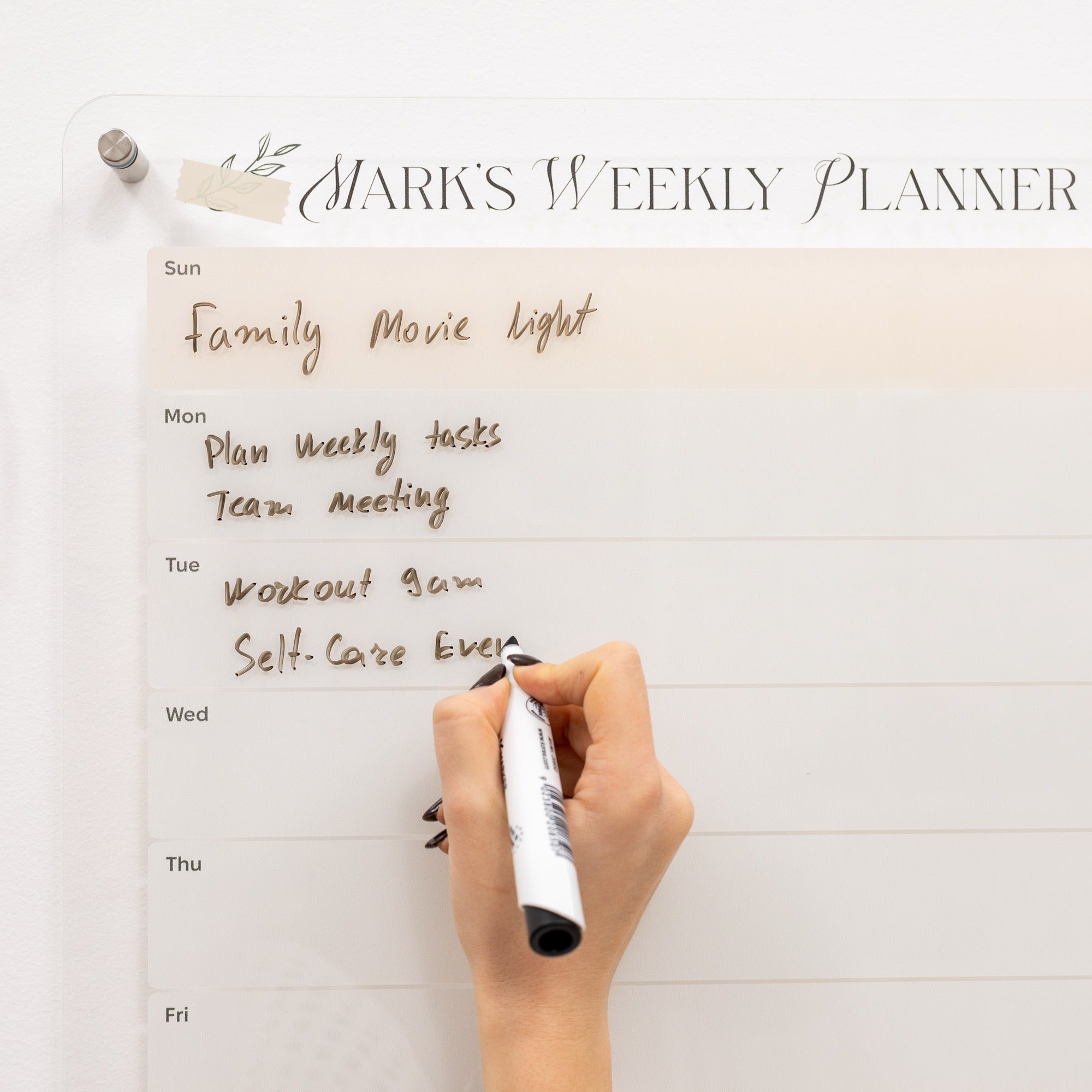 Hand writing on a weekly planner with 'Mark's Weekly Planner' at the top.