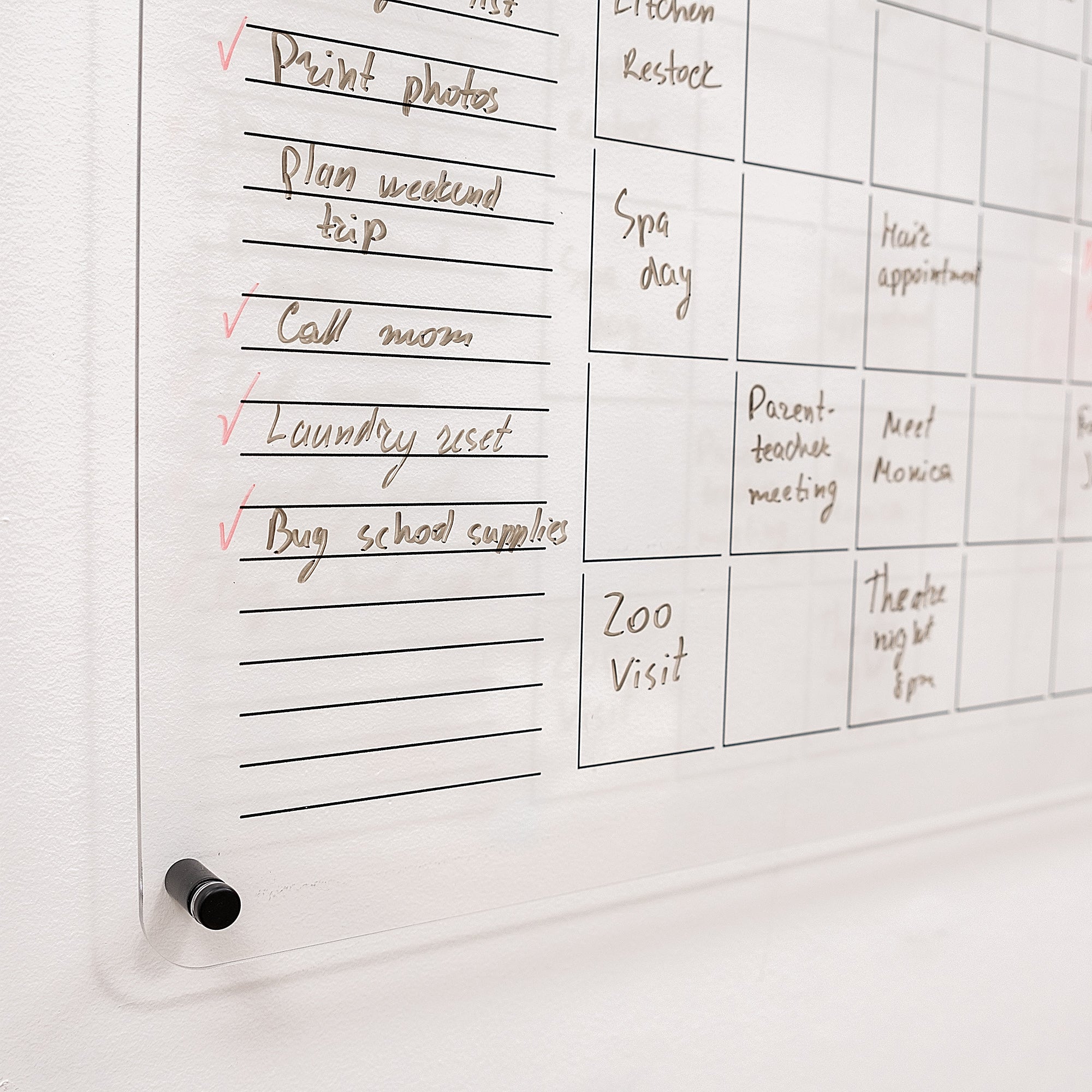 Whiteboard with a to-do list and scheduled events written on it.