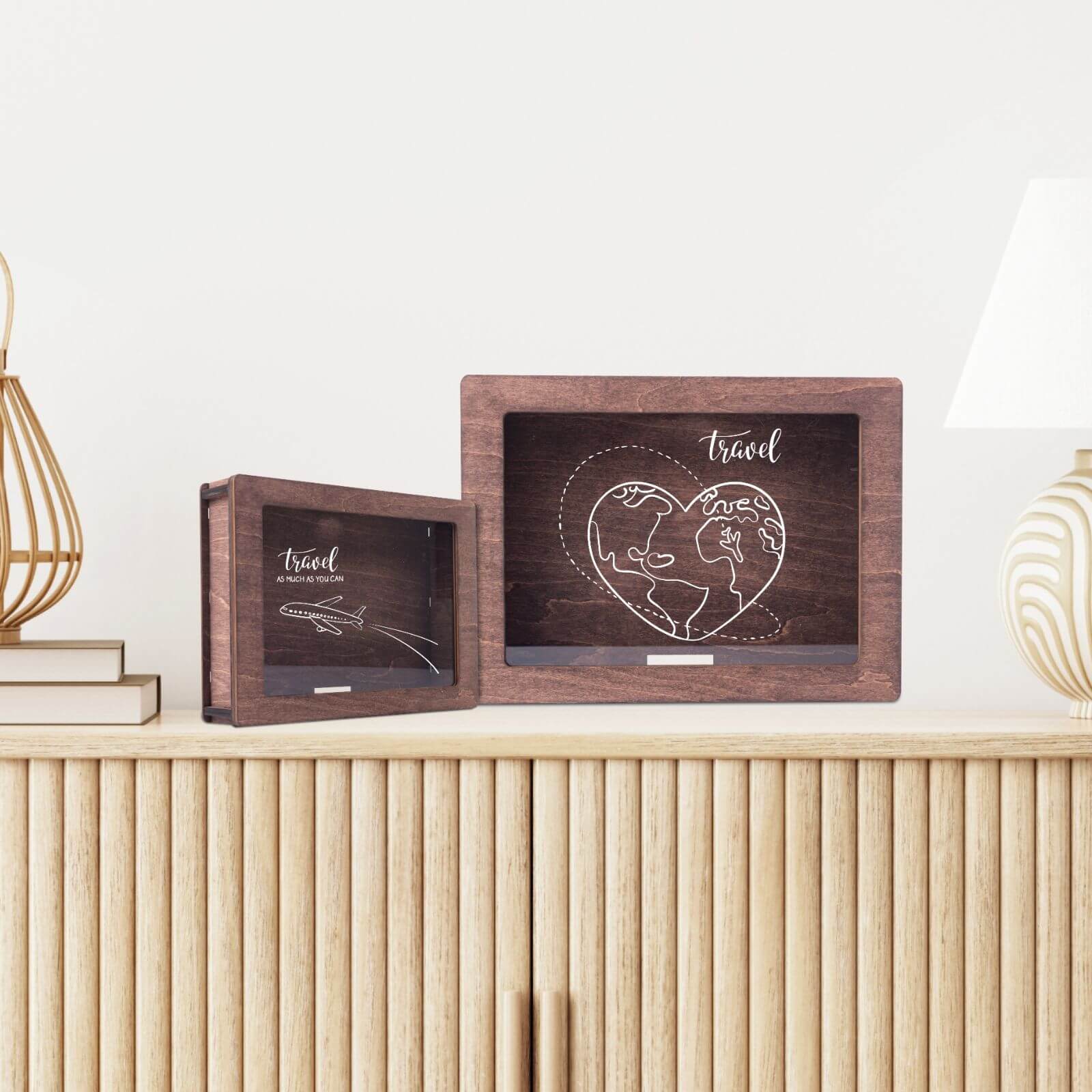 A wooden wine cork box with a glass front displaying text and a wine tap illustration, placed on a table with wine glasses and bottles in the background.