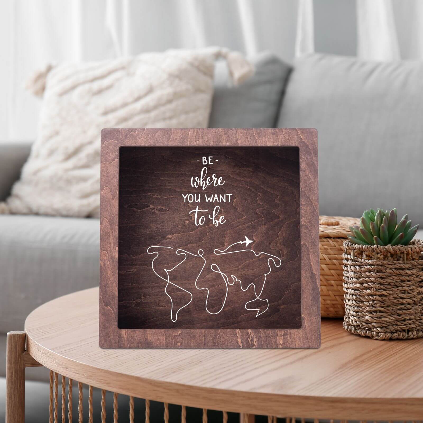 Wooden shadow box with travel-themed design 'Be where you want to be' and world map illustration