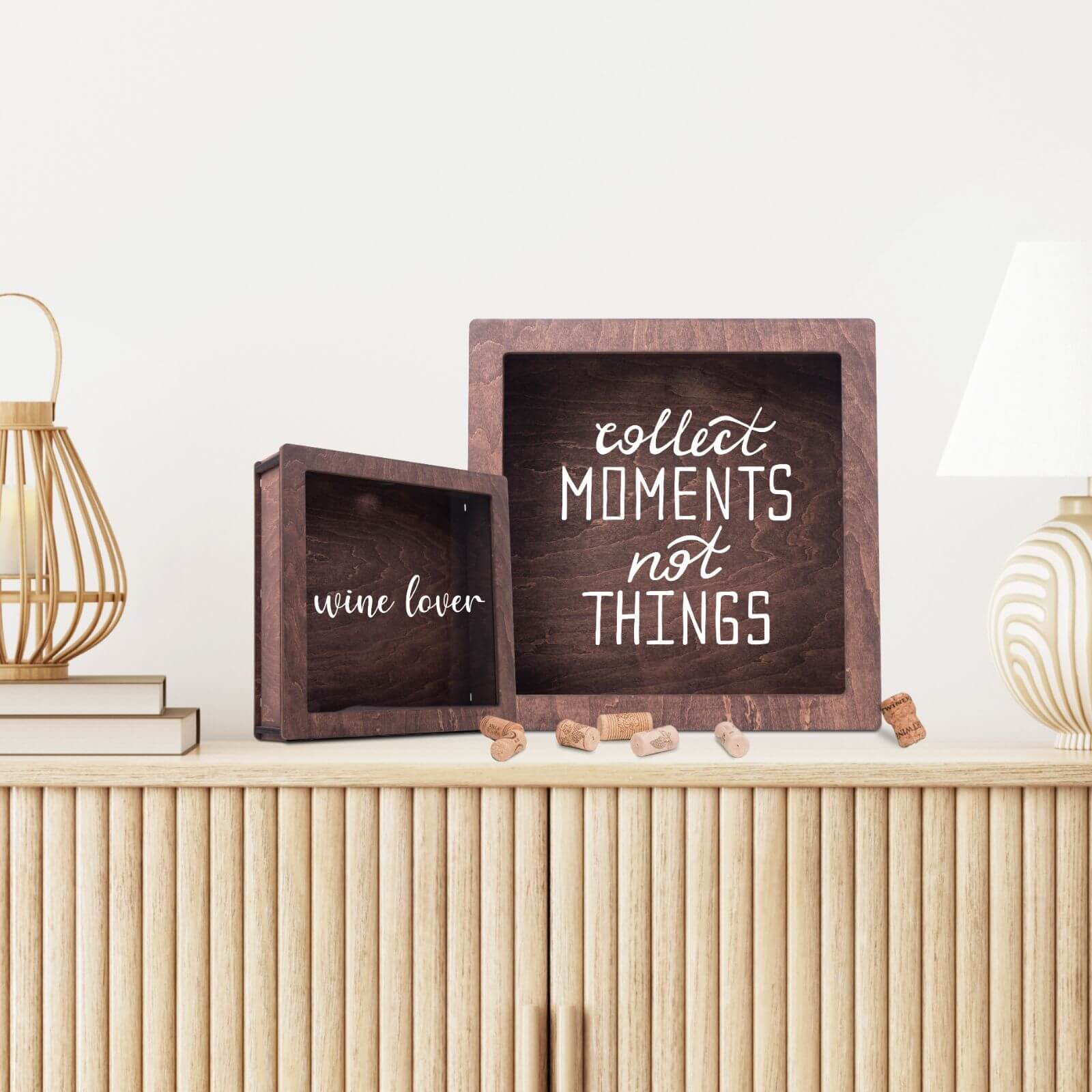 Two engraved cork shadow boxes with “Collect Moments Not Things” and “Wine Lover” designs.