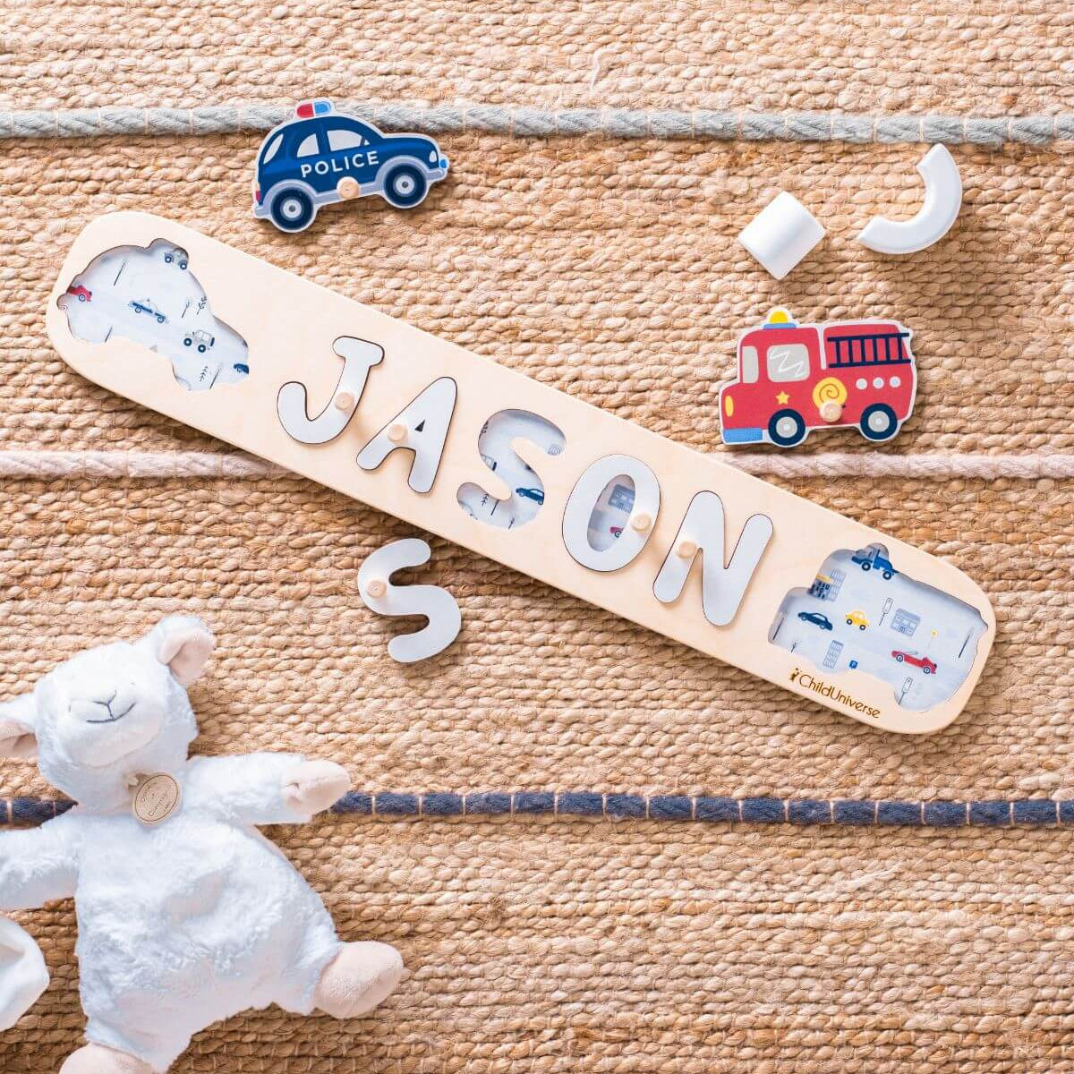 Wooden nameplate with 'JASON' on a textured surface with toys around