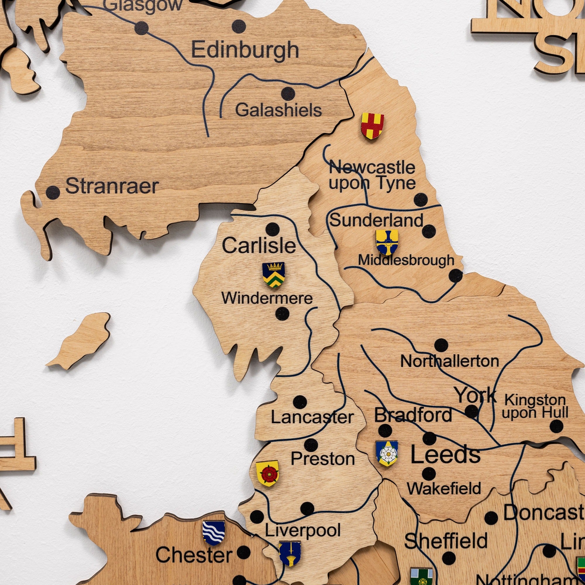Wooden map of the United Kingdom with cities labeled