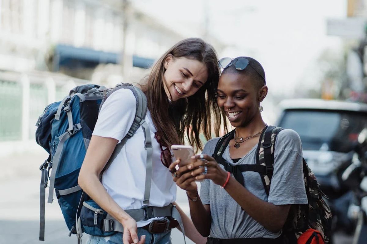 A couple of women looking at a phone