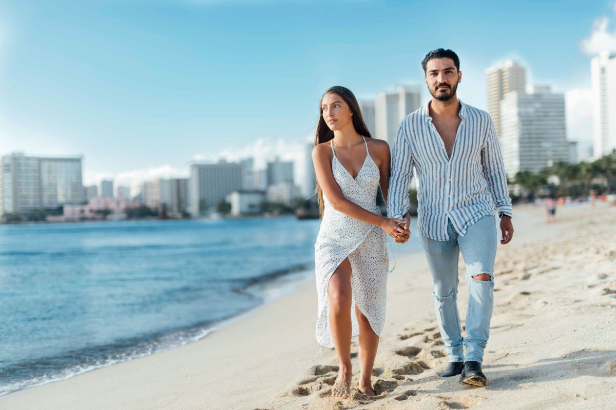 A couple walking on the beach