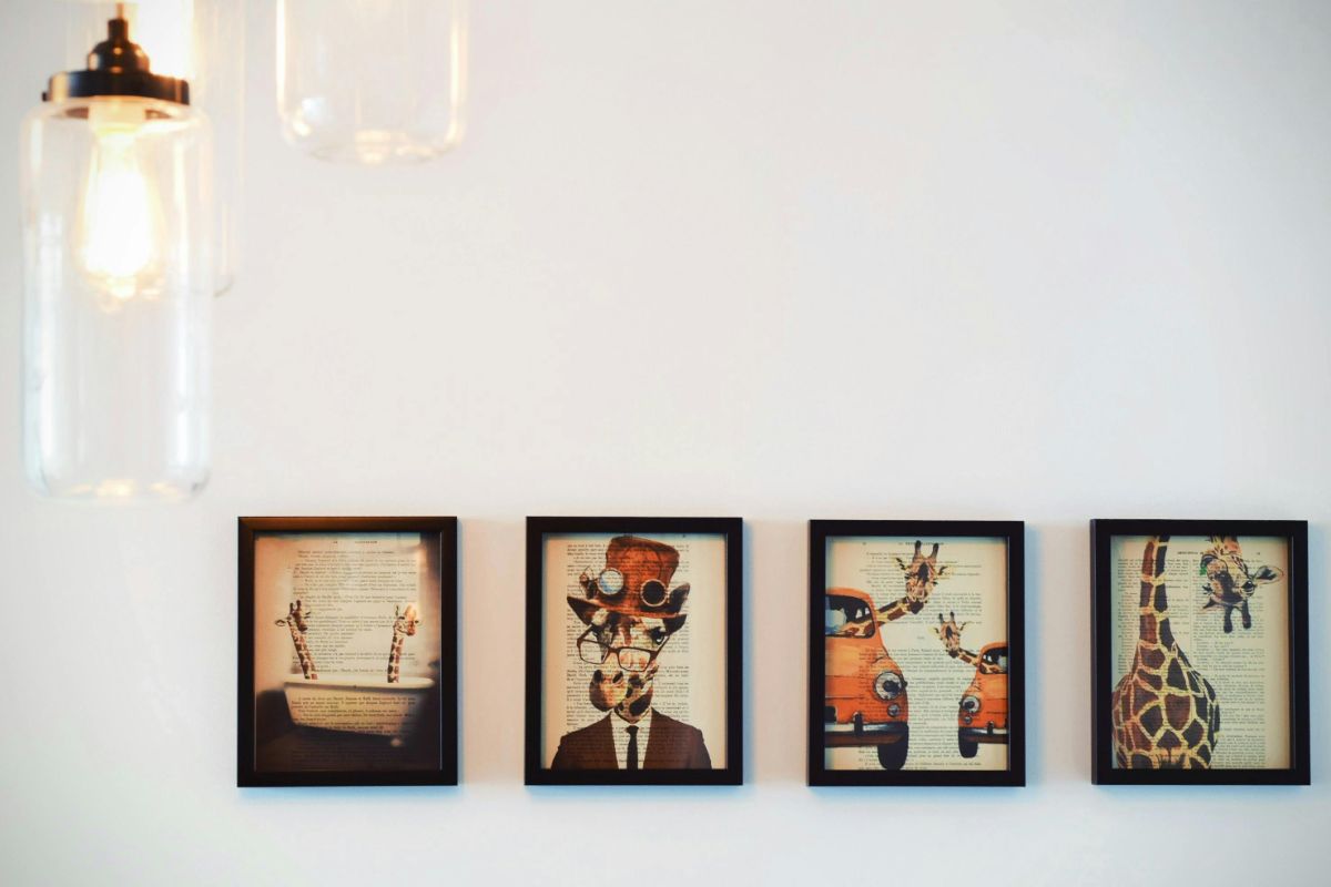 Four paintings on a white wall