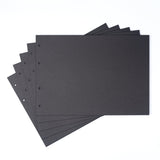 Stack of black sheets with holes on a white background