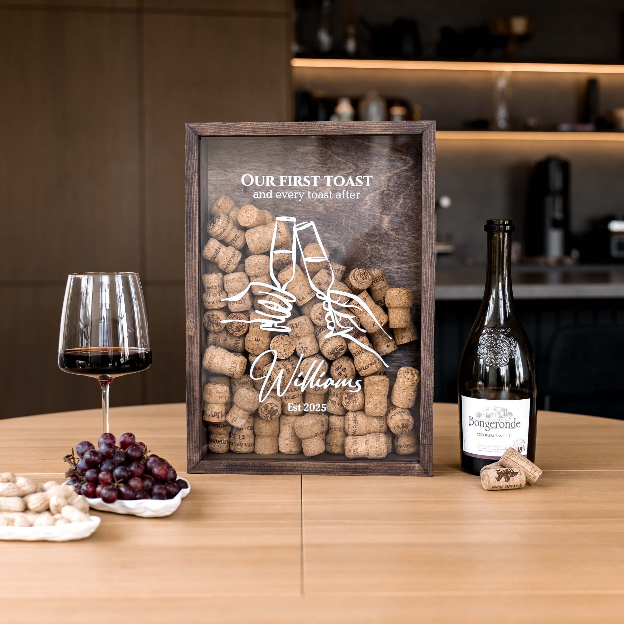 A personalized wooden wine cork wall art piece on a wooden table