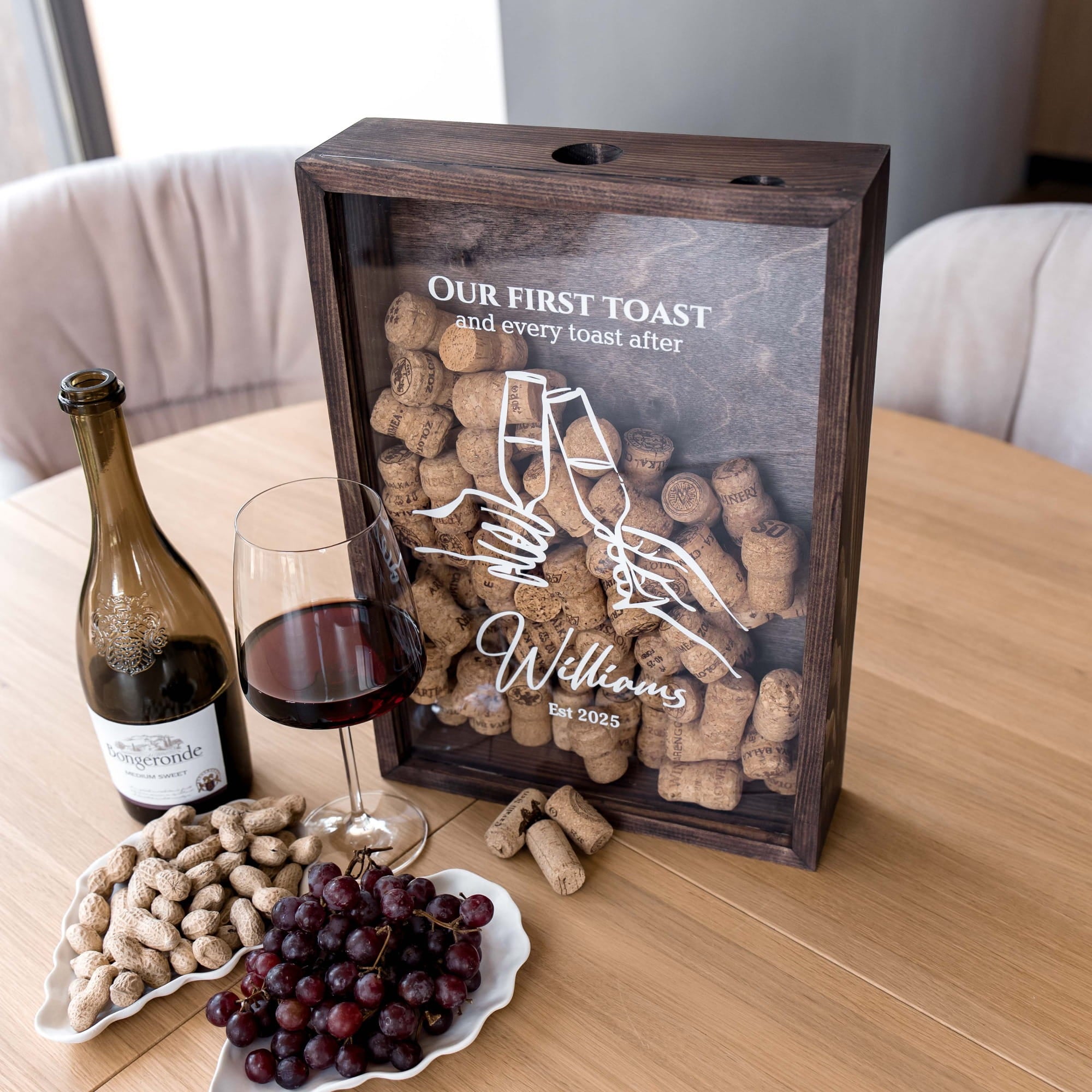 A dark wooden wine cork box with a clear front panel