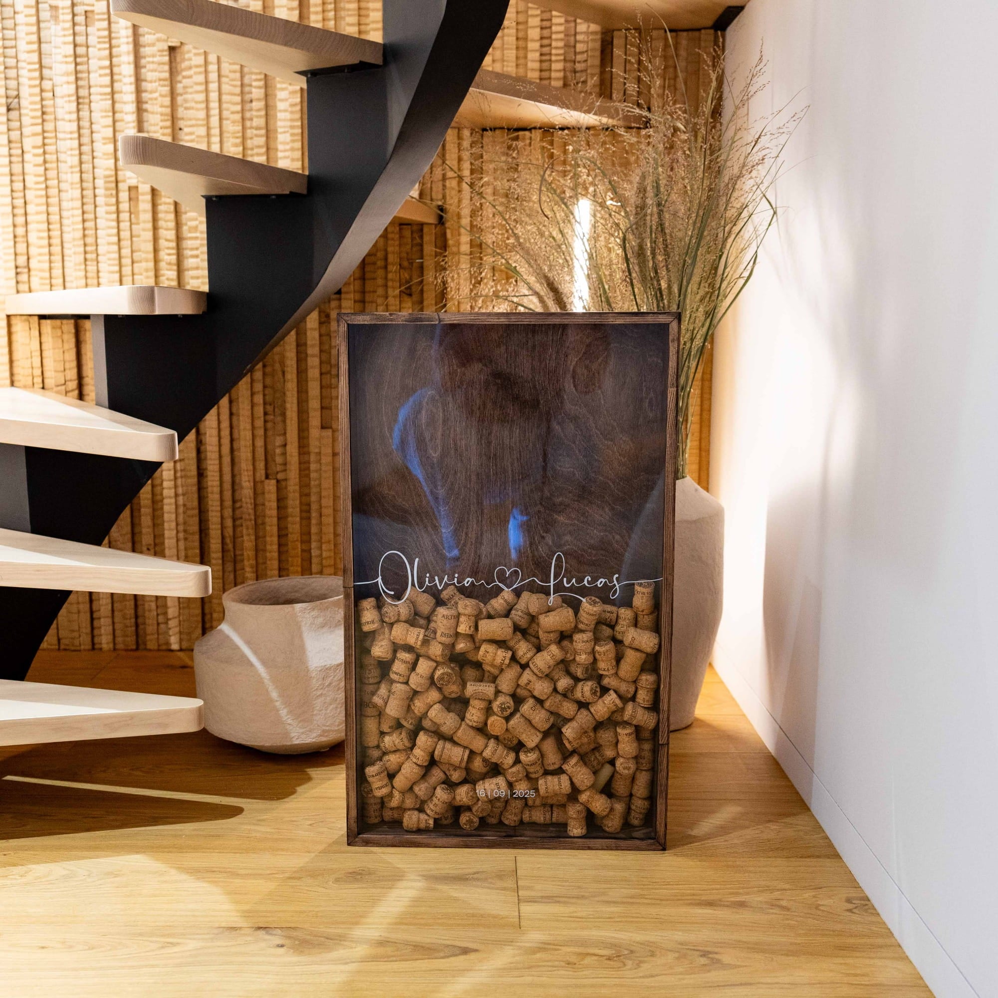 A rectangular wooden shadow box display filled with wine corks