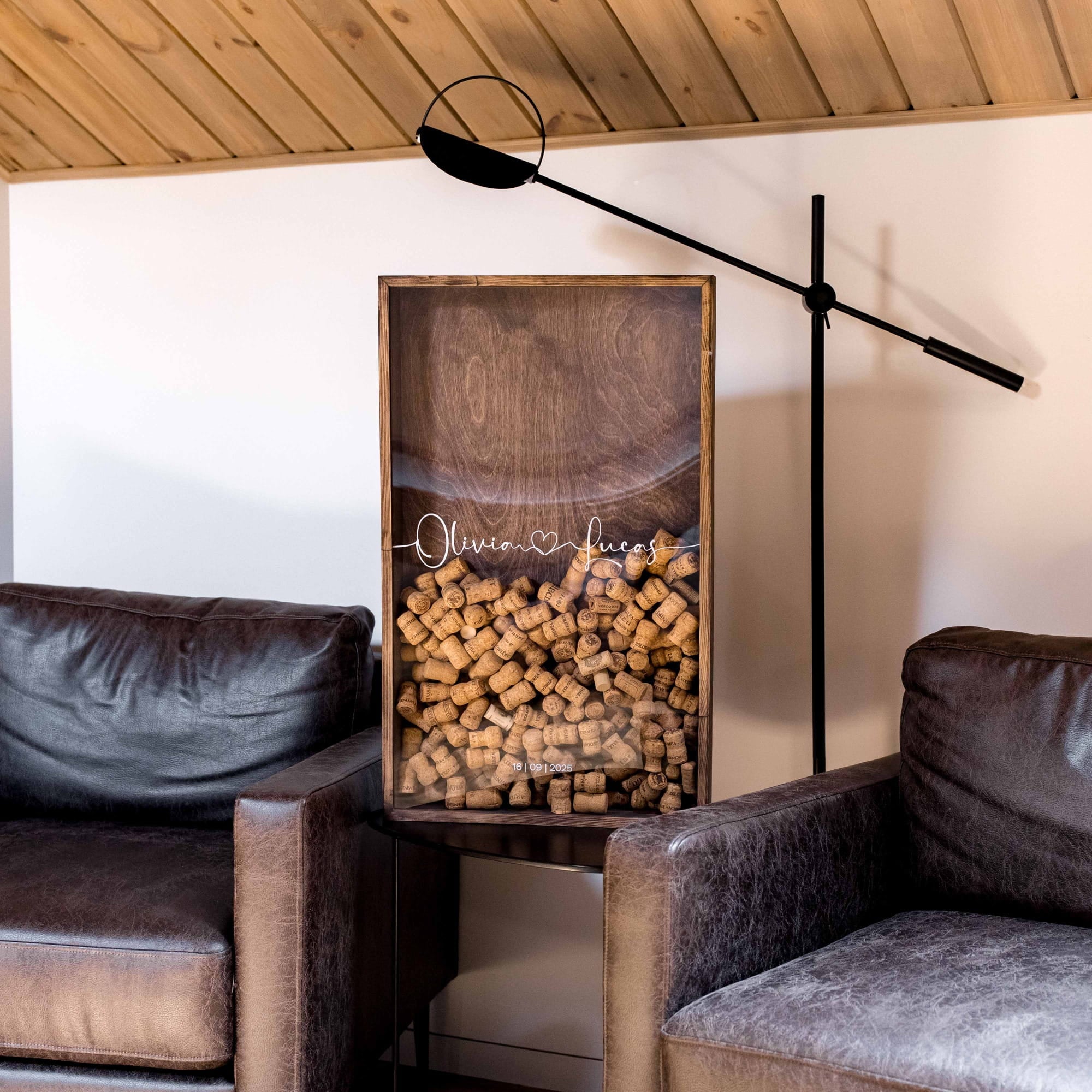 A decorative wooden framed display filled with wine bottle caps