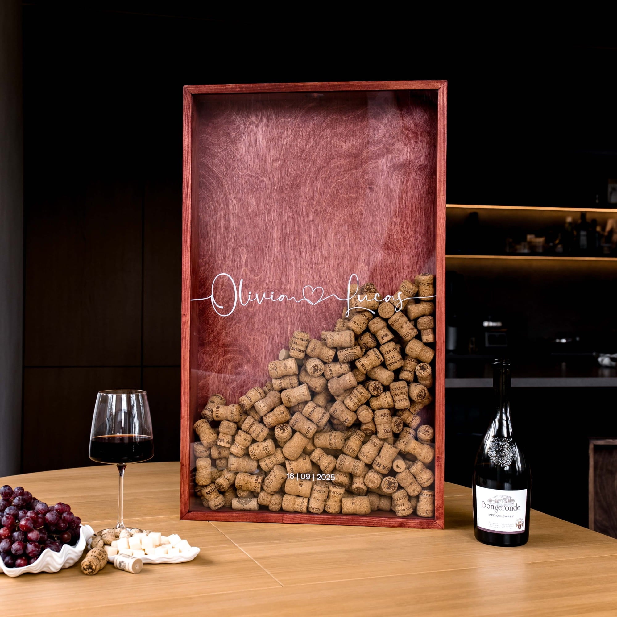 A wooden framed display with wine cork