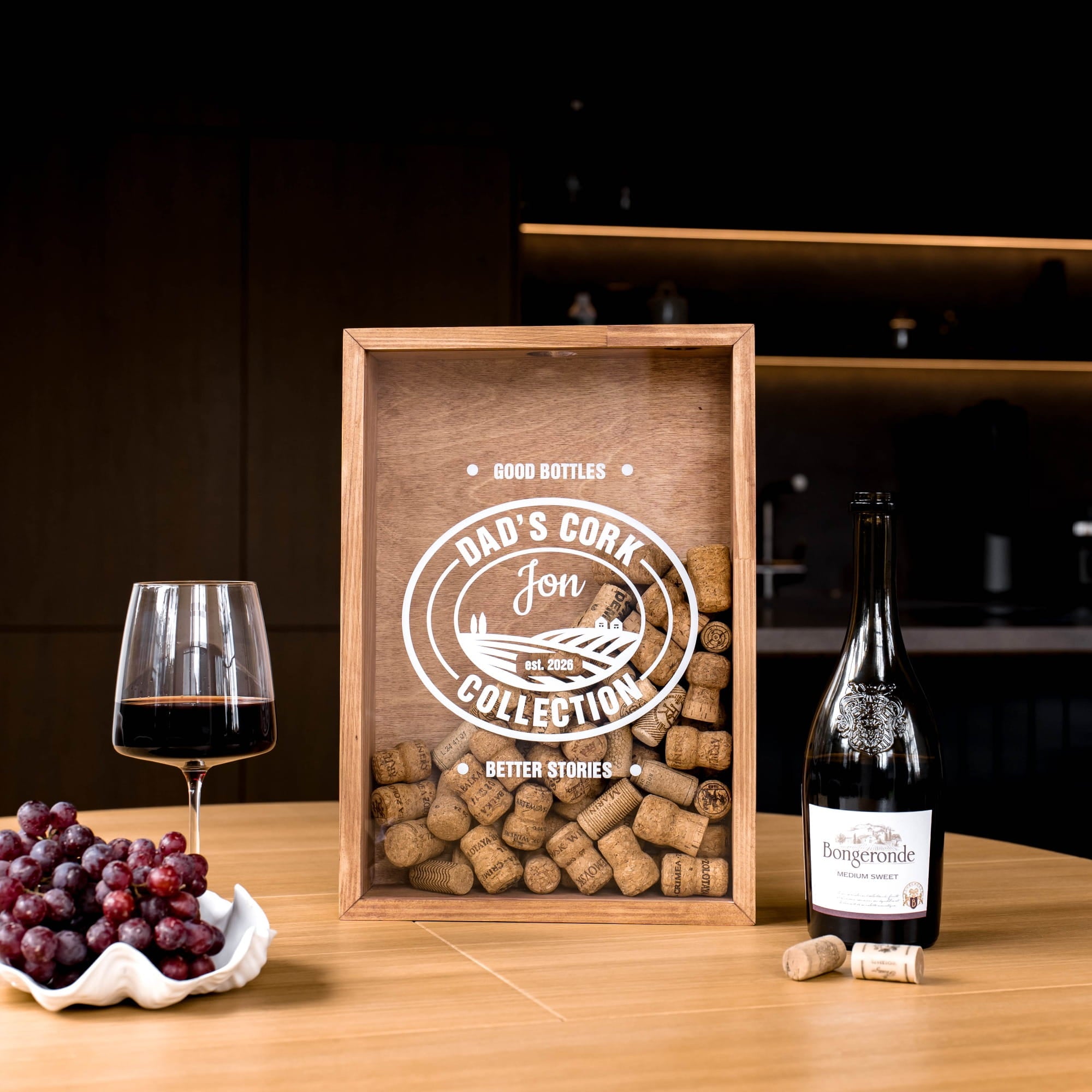 A personalized wooden wine cork box with a clear front panel