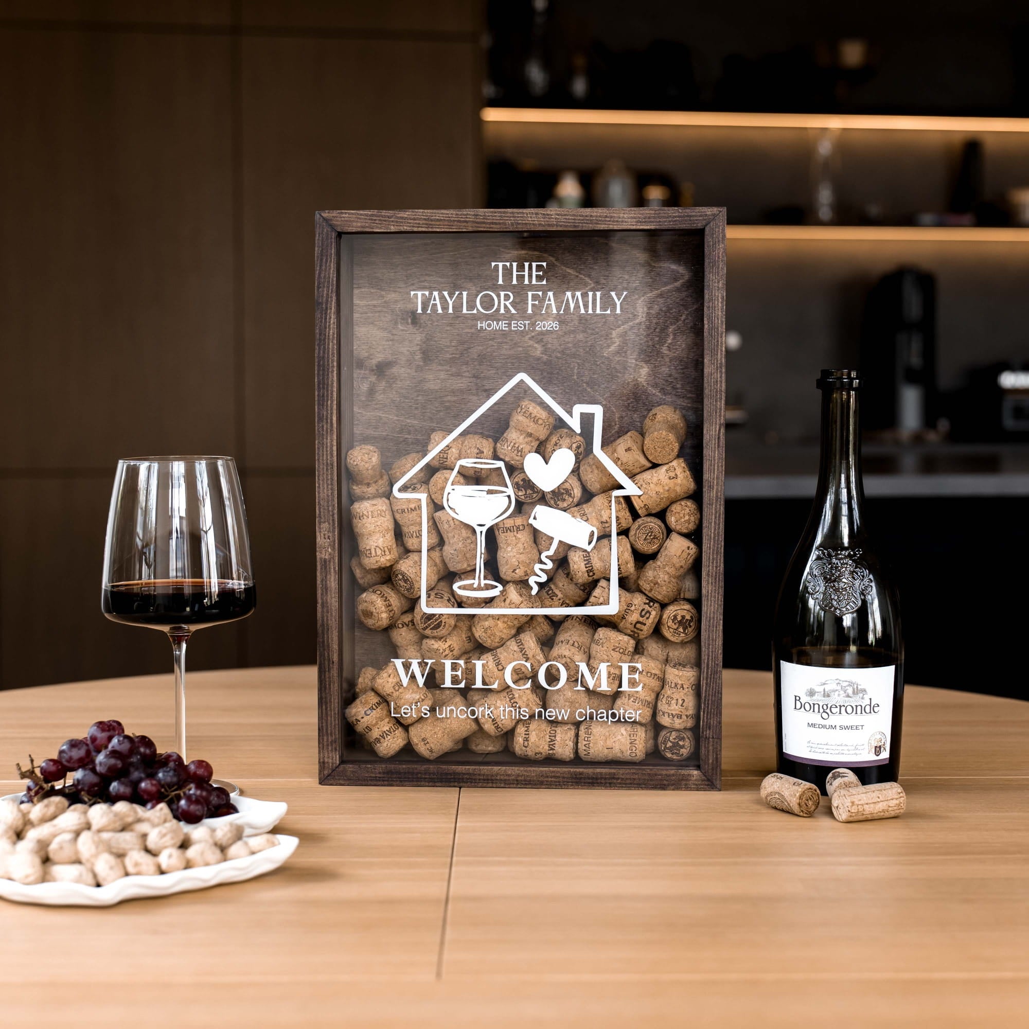 A personalized wooden wine cork display box on a wooden table