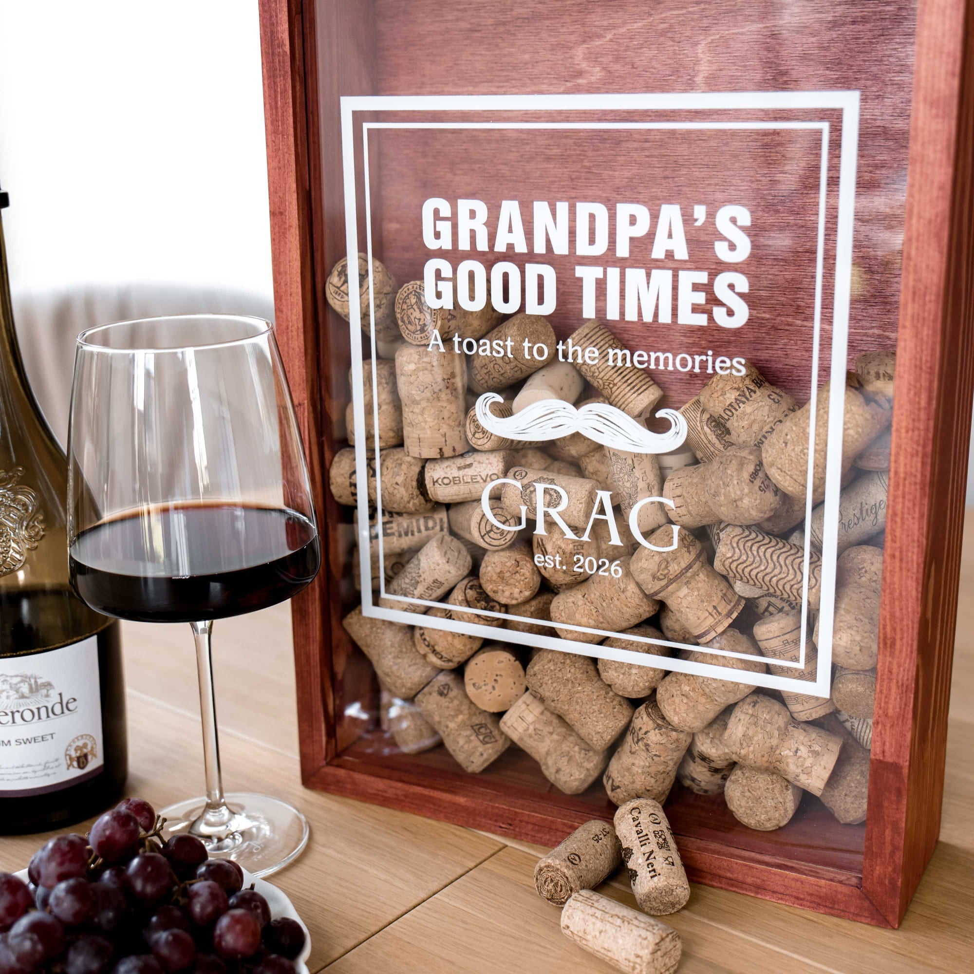 A wooden shadow box filled with wine corks