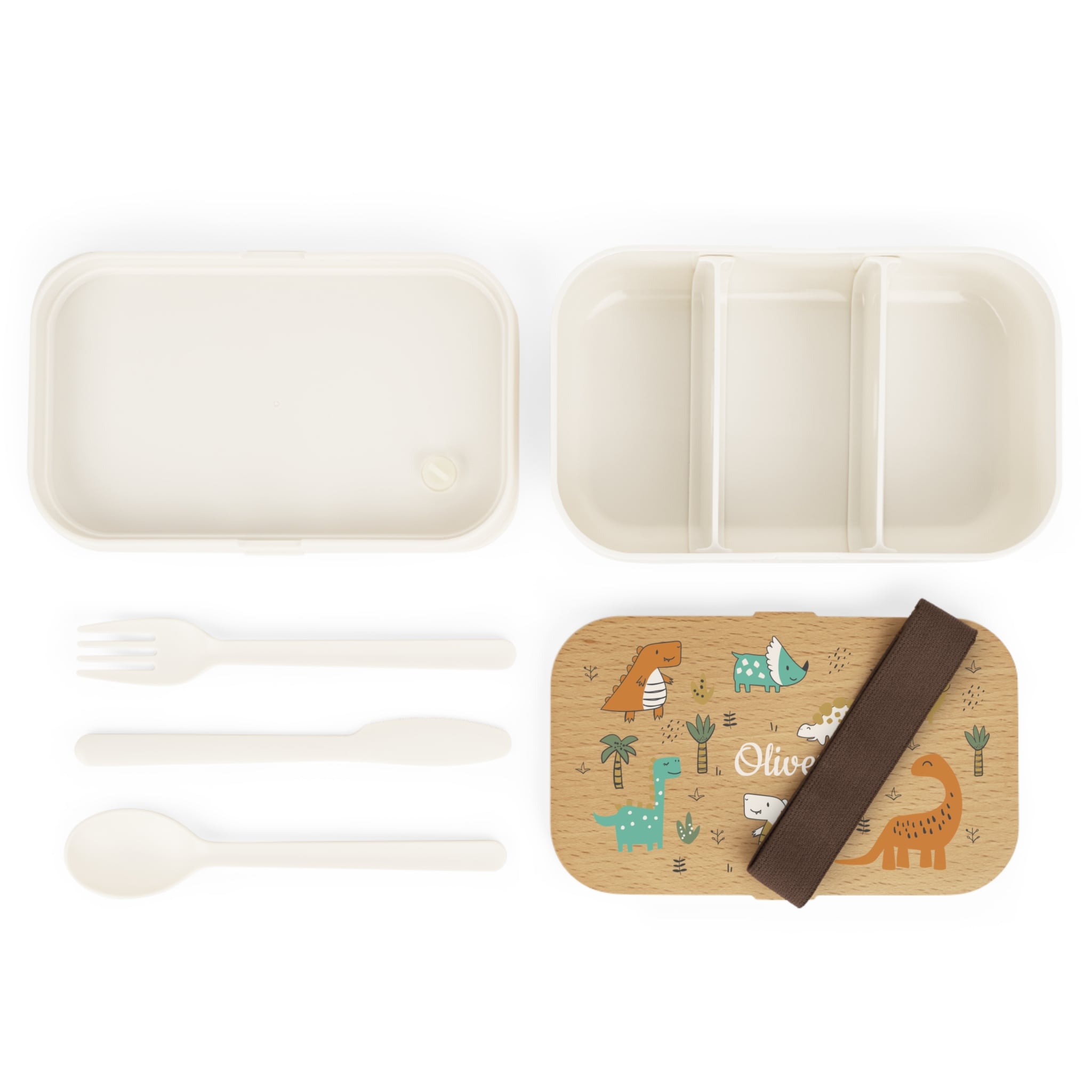 Set of bamboo lunch box, fork, spoon, and placemat with dinosaur design on a white background