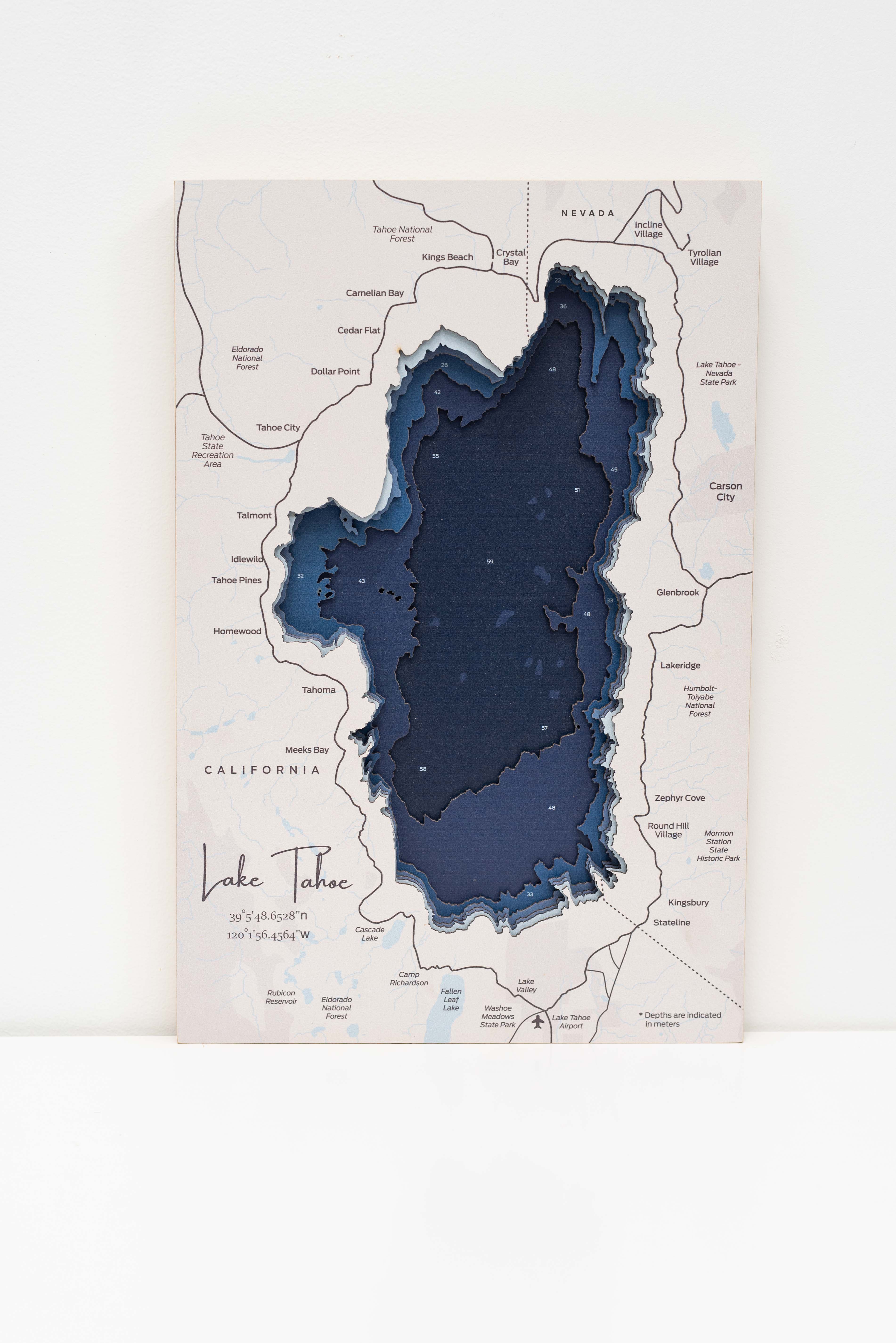 Map of Lake Tahoe with a three-dimensional blue depiction on a white background