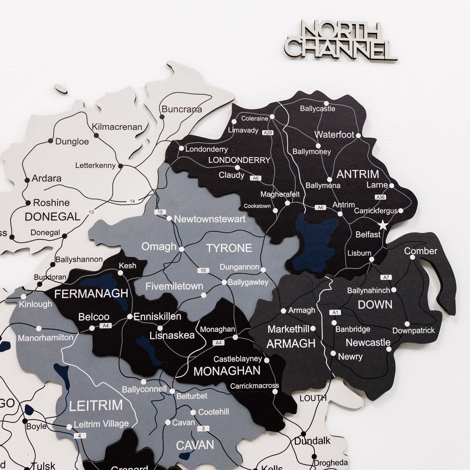 Map of Northern Ireland with counties colored in black, gray, and white, featuring 'North Channel' branding.