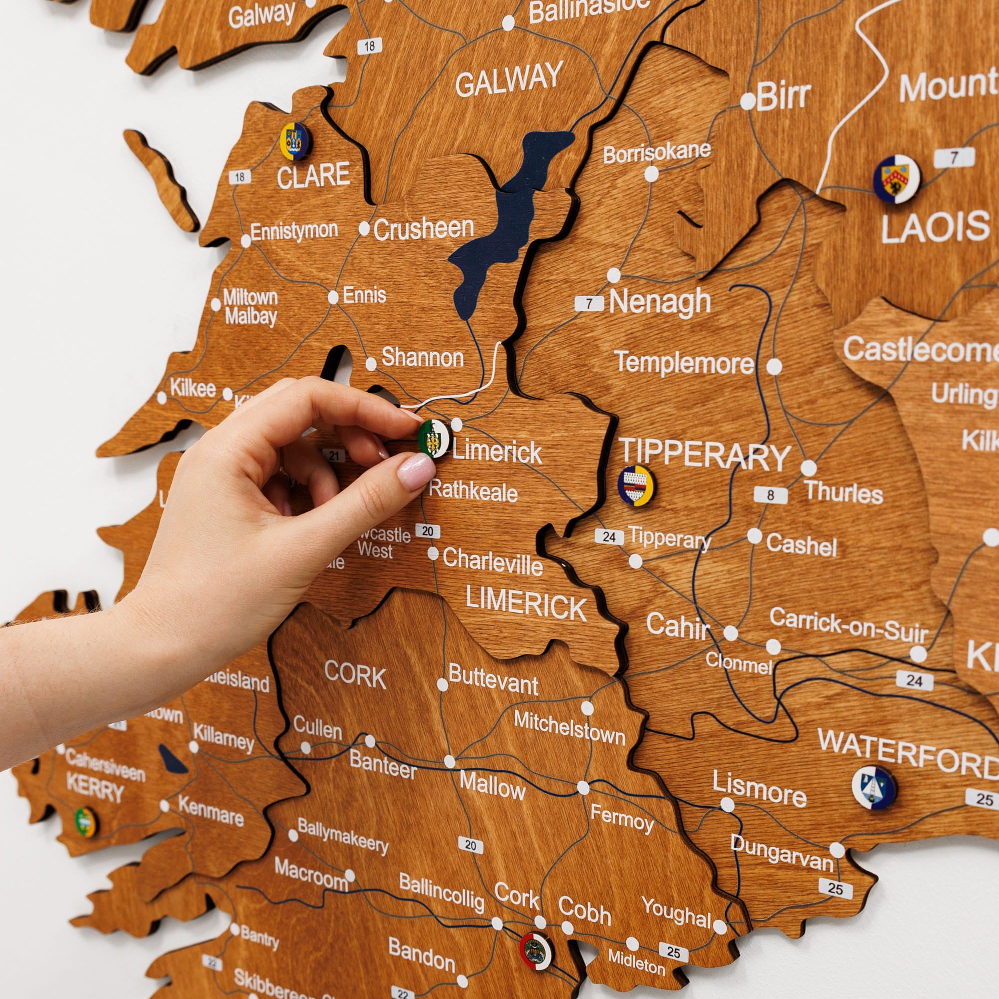 Wooden map of Ireland with a hand pointing to Tipperary