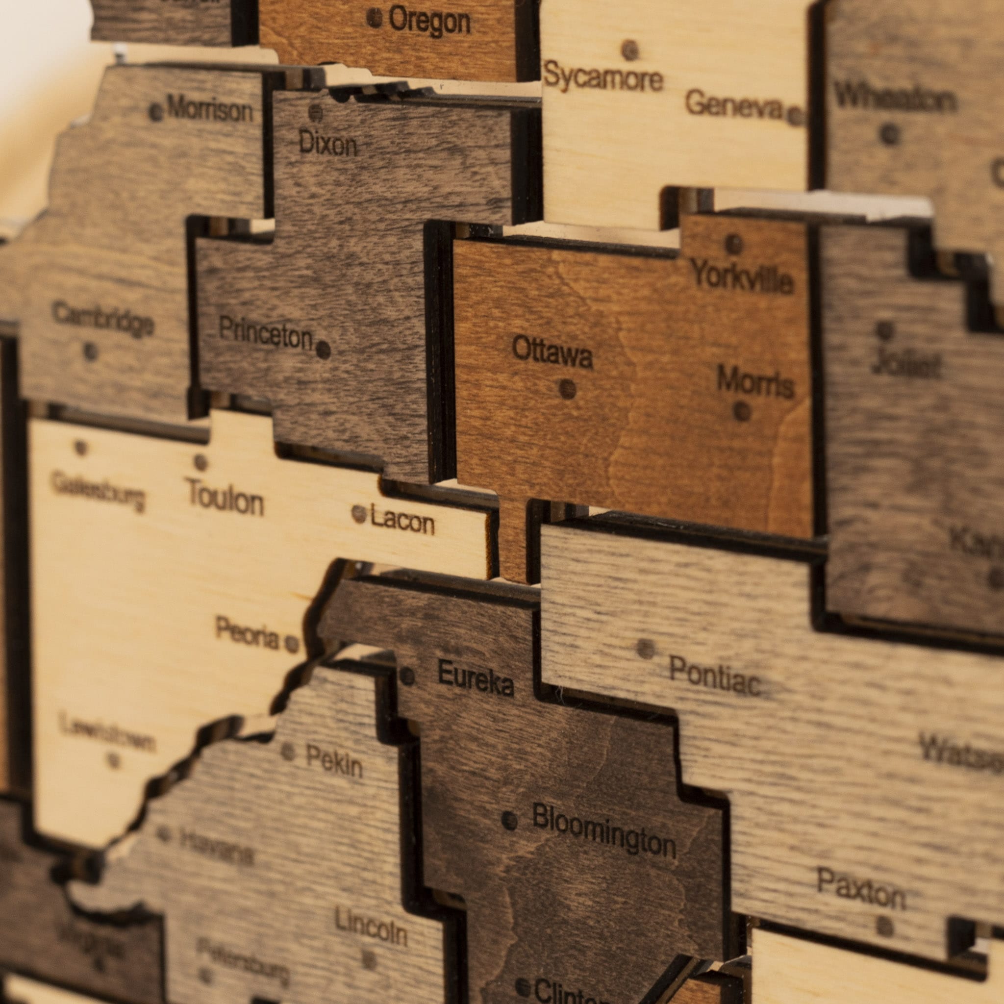 Wooden blocks with city names on a wooden board