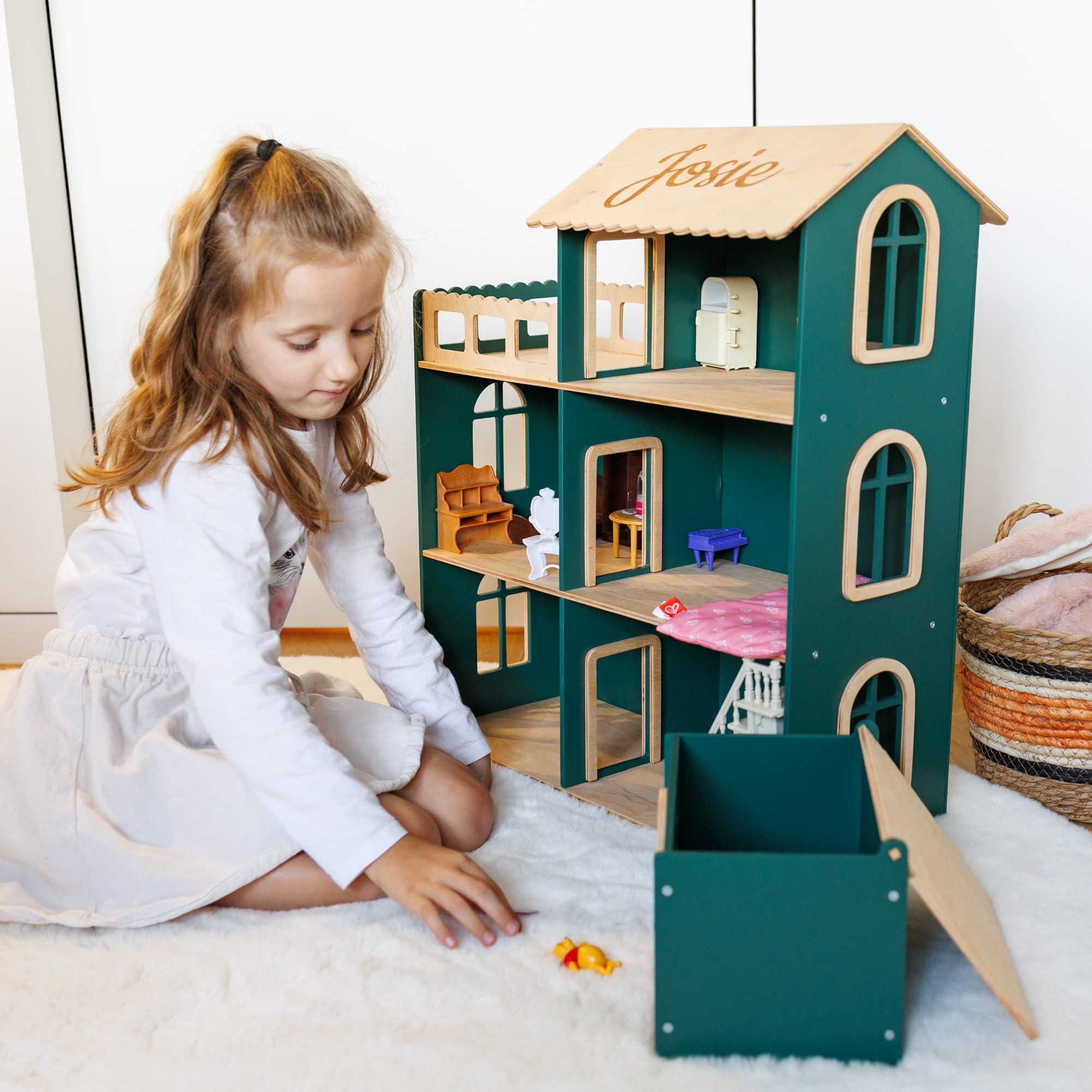 large green wooden dollhouse