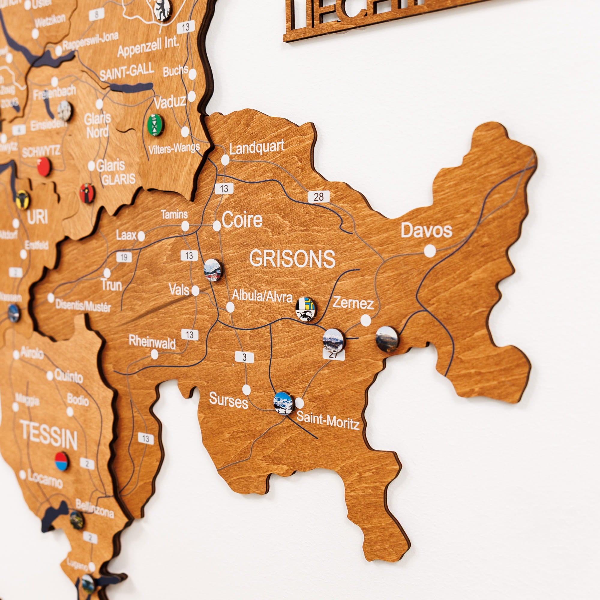 Wooden map of Switzerland on a white wall