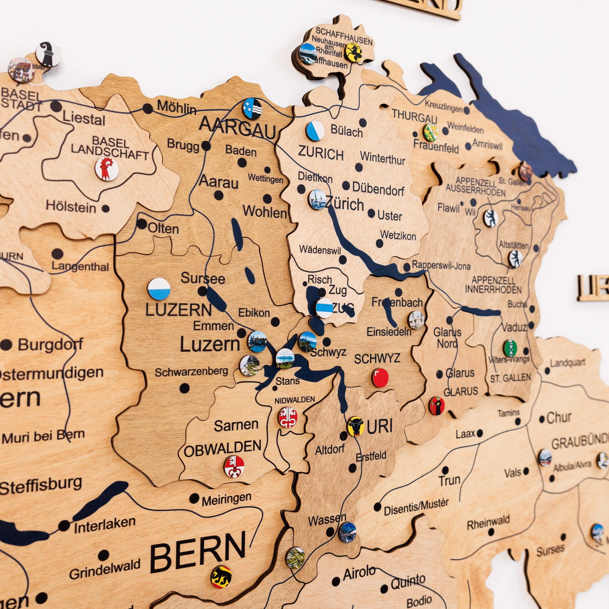 Wooden map of Switzerland with cities and regions labeled