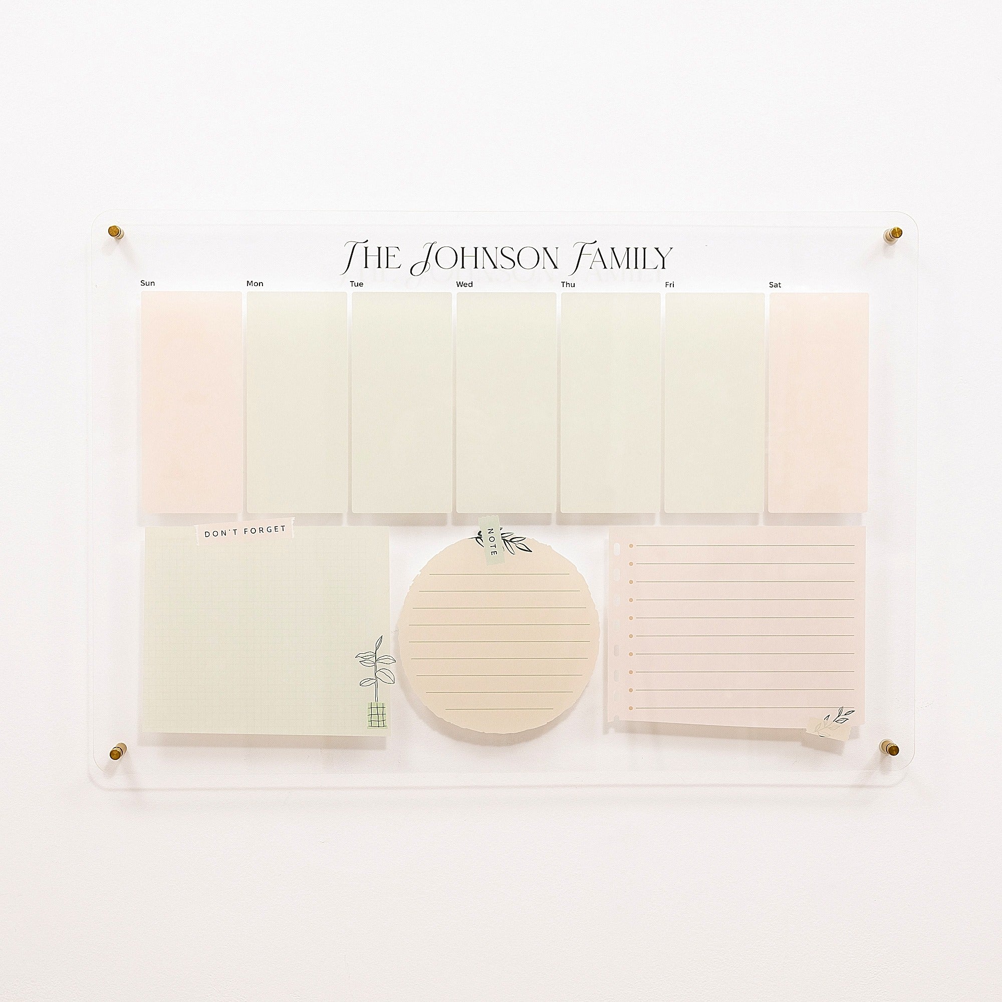Personalized family planner with notes and a circular sticky note pad on a white background.