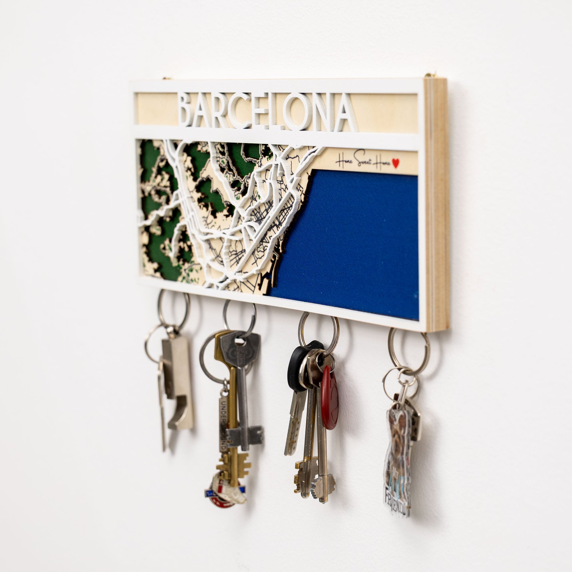 Key holder with 'Barcelona' display on a white wall