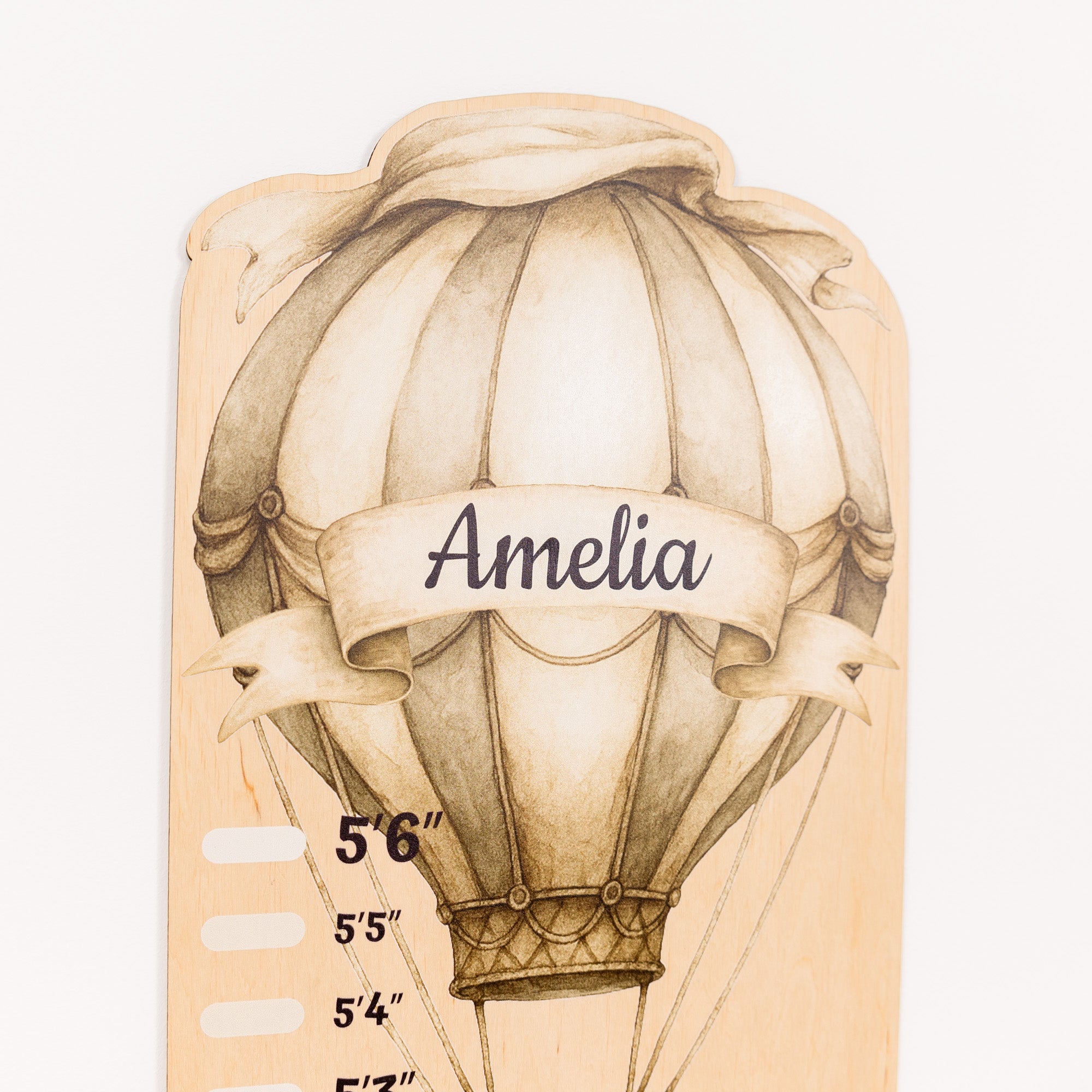 Hot air balloon height chart with 'Amelia' on a beige background