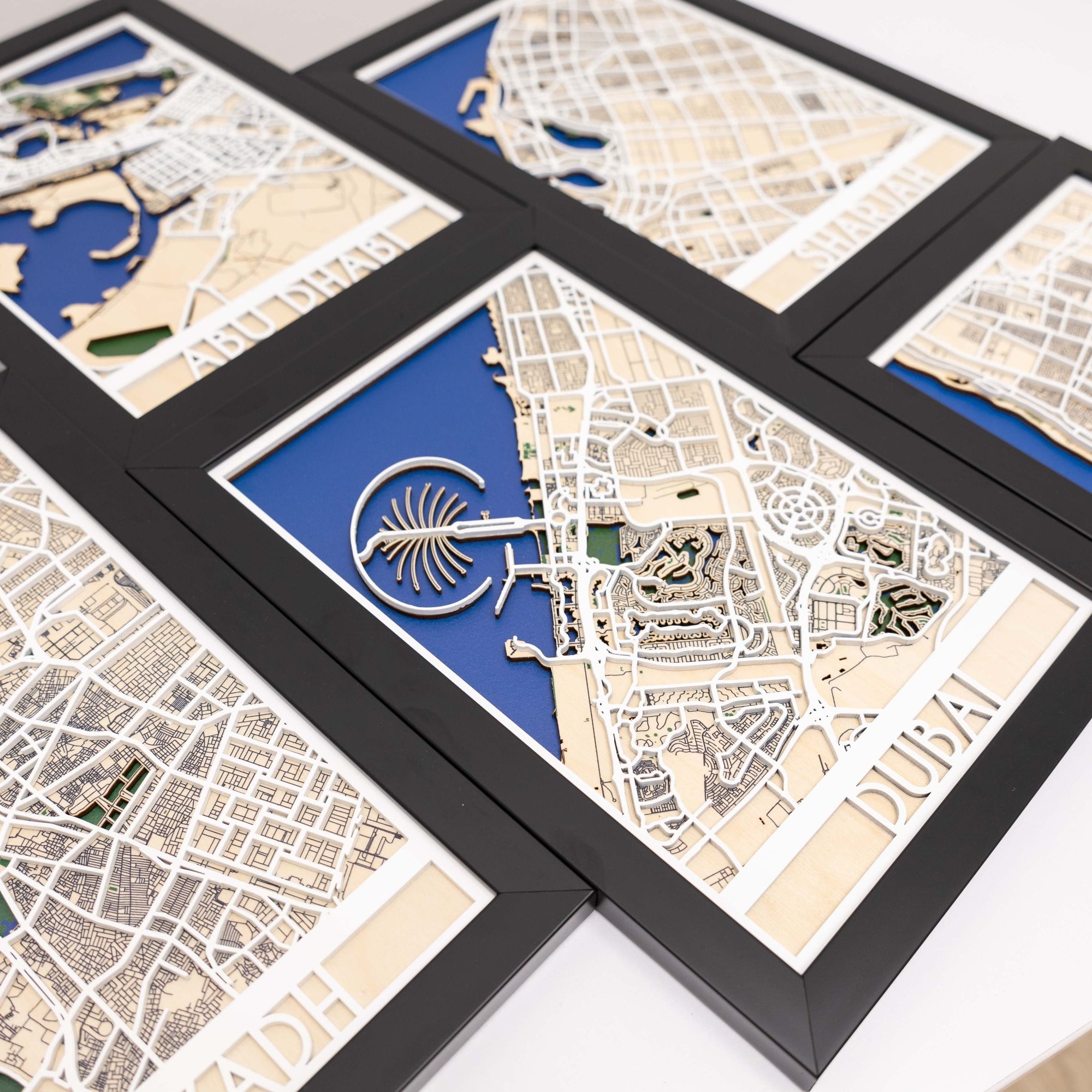 Framed map of Dubai with a stylized palm tree design on a white background