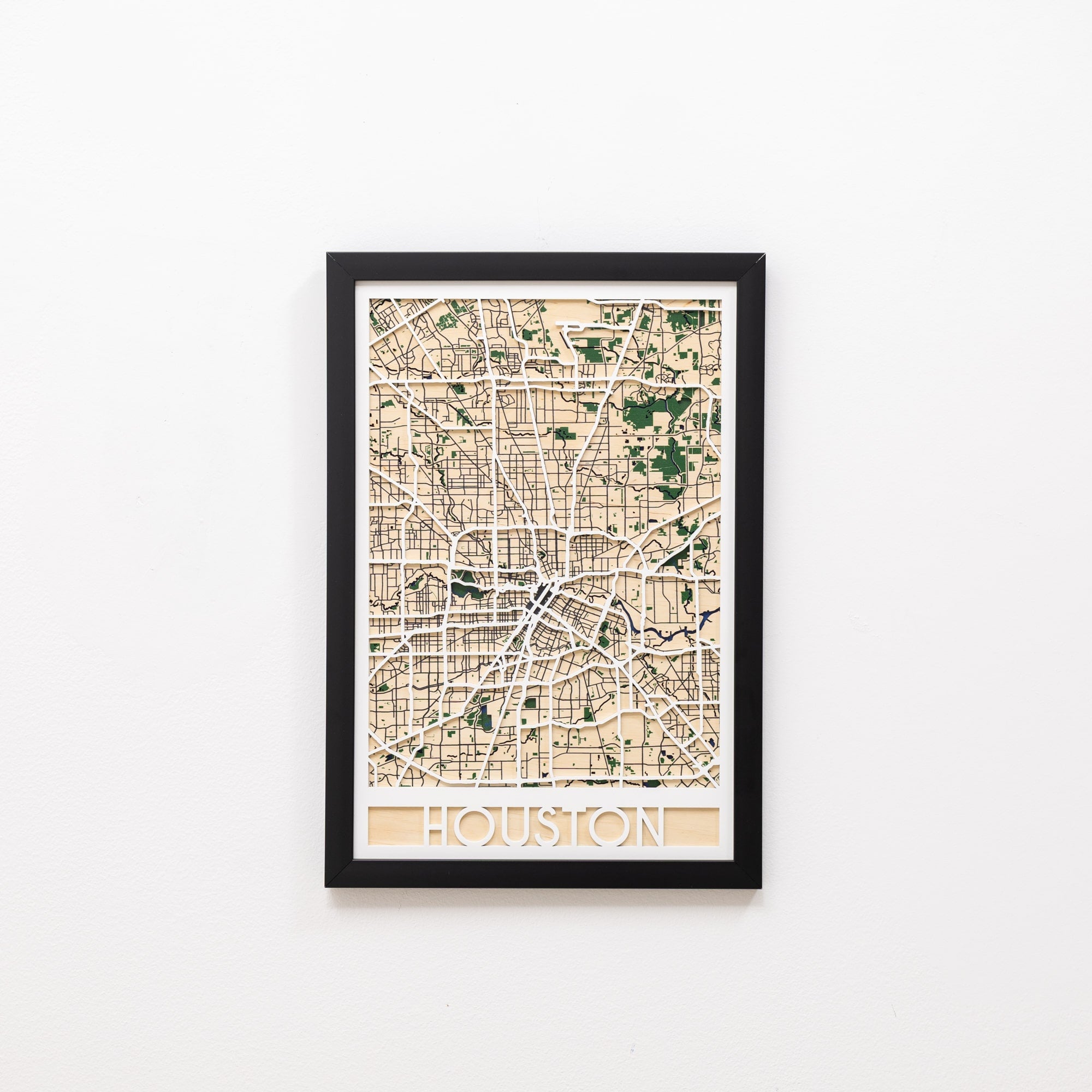 Framed map of Houston on a white wall